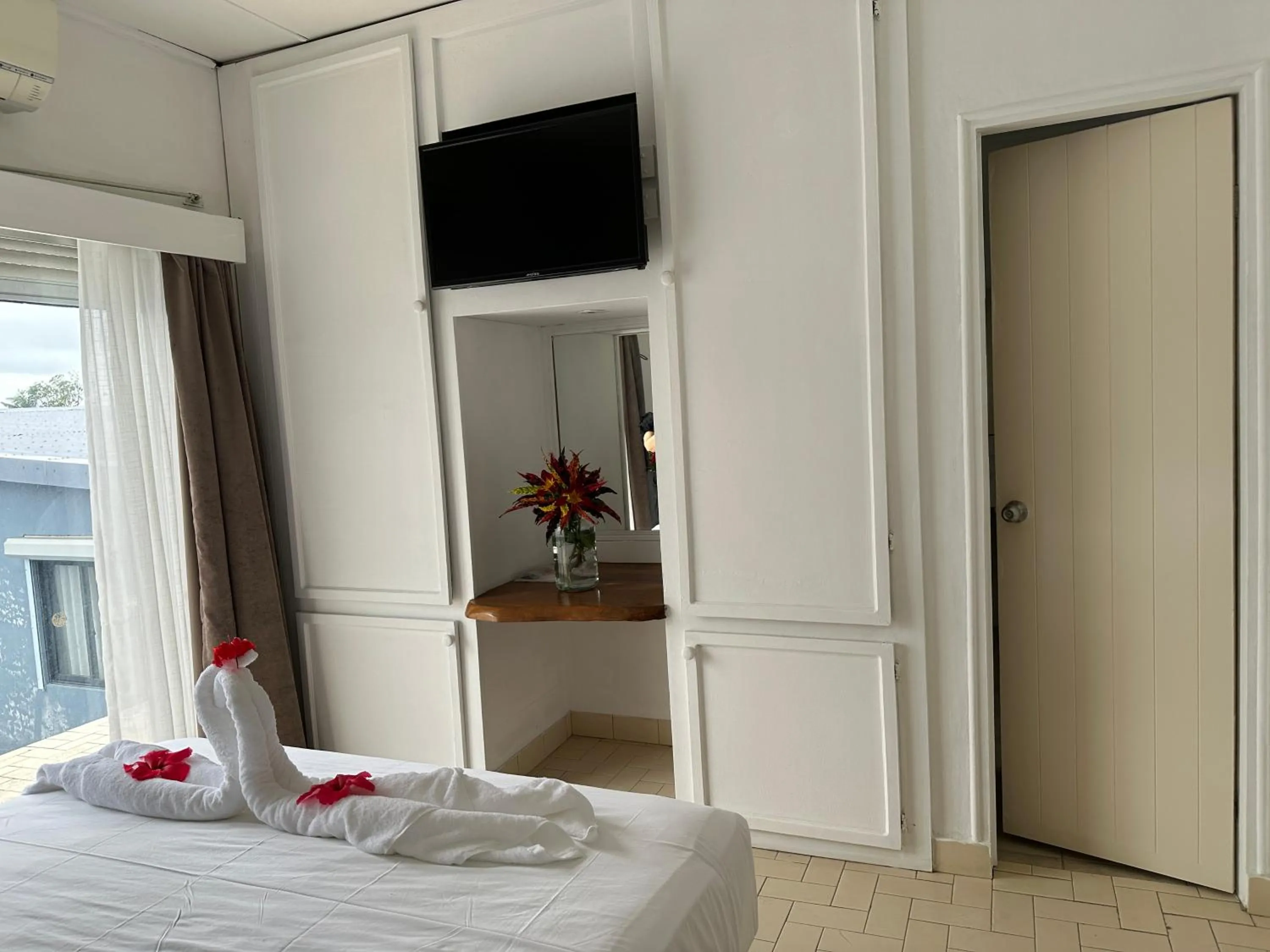 Bed in Coconut Palms Resort & Diamond Casino