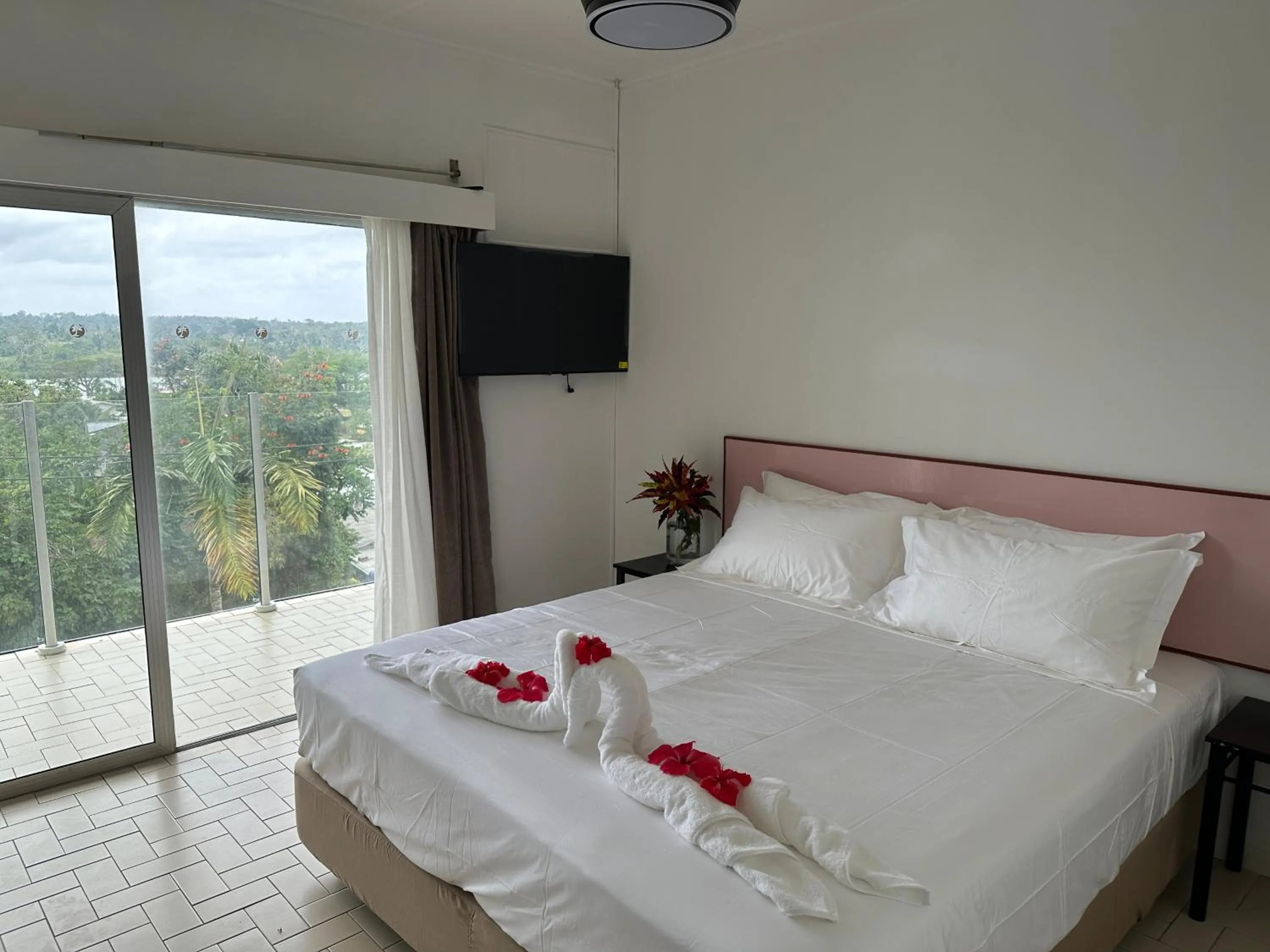 Bed in Coconut Palms Resort & Diamond Casino