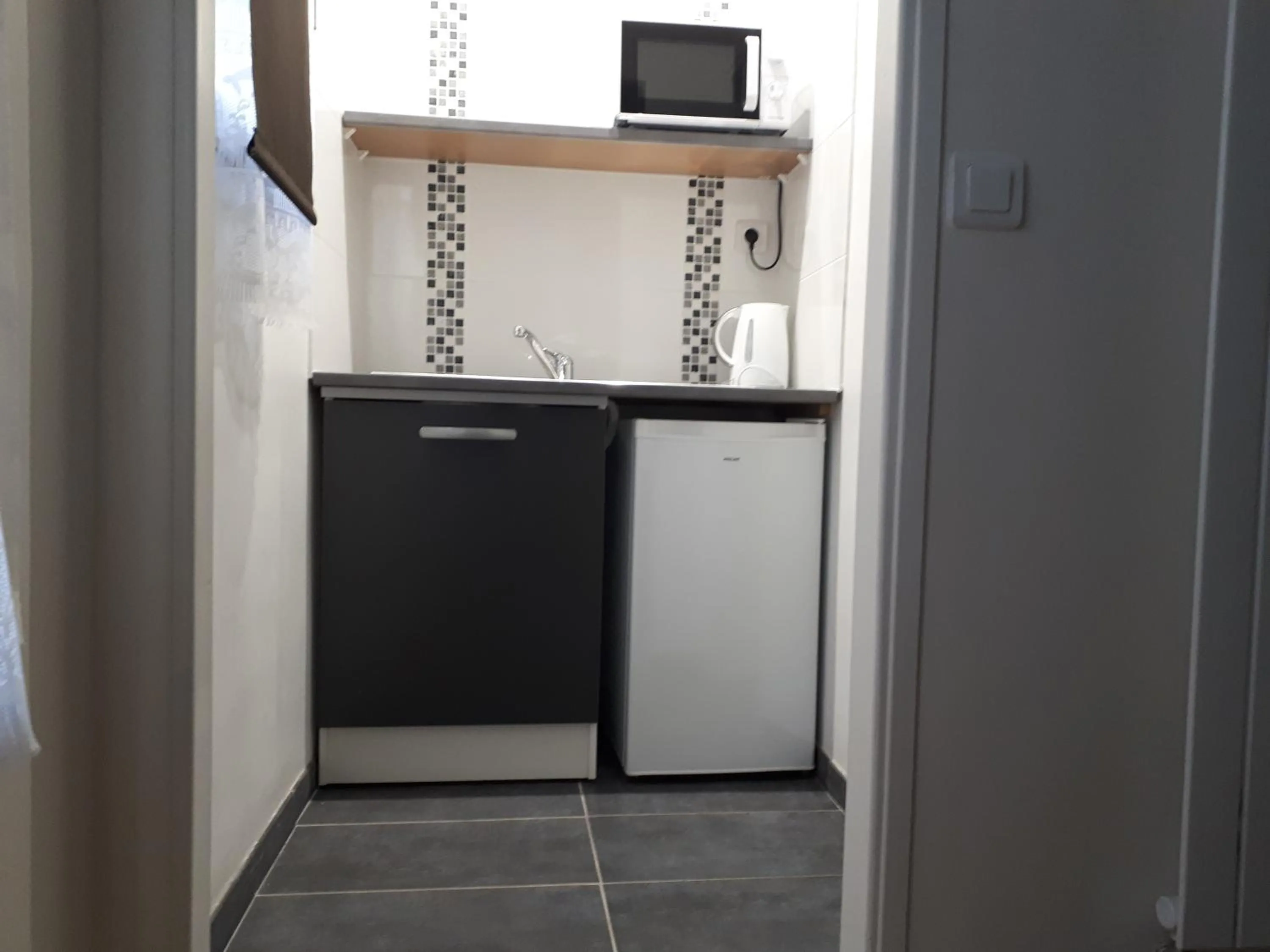 Kitchen or kitchenette in Hôtel Résidence Champerret