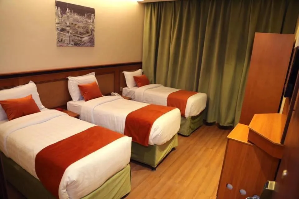 Bed in Al Bostan Al Masi Hotel