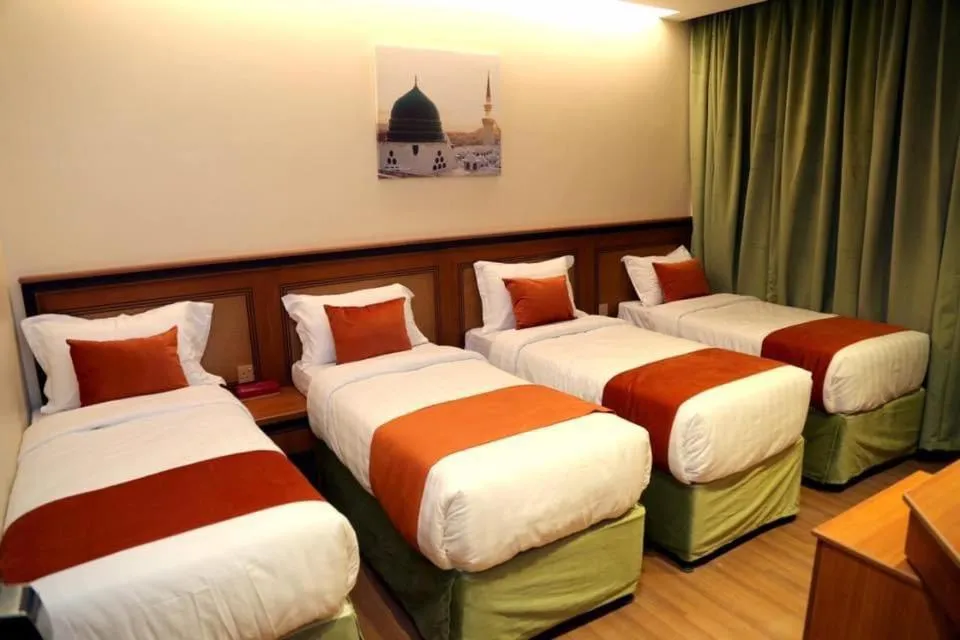 Bed in Al Bostan Al Masi Hotel