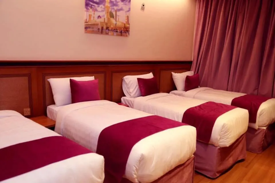 Bed in Al Bostan Al Masi Hotel