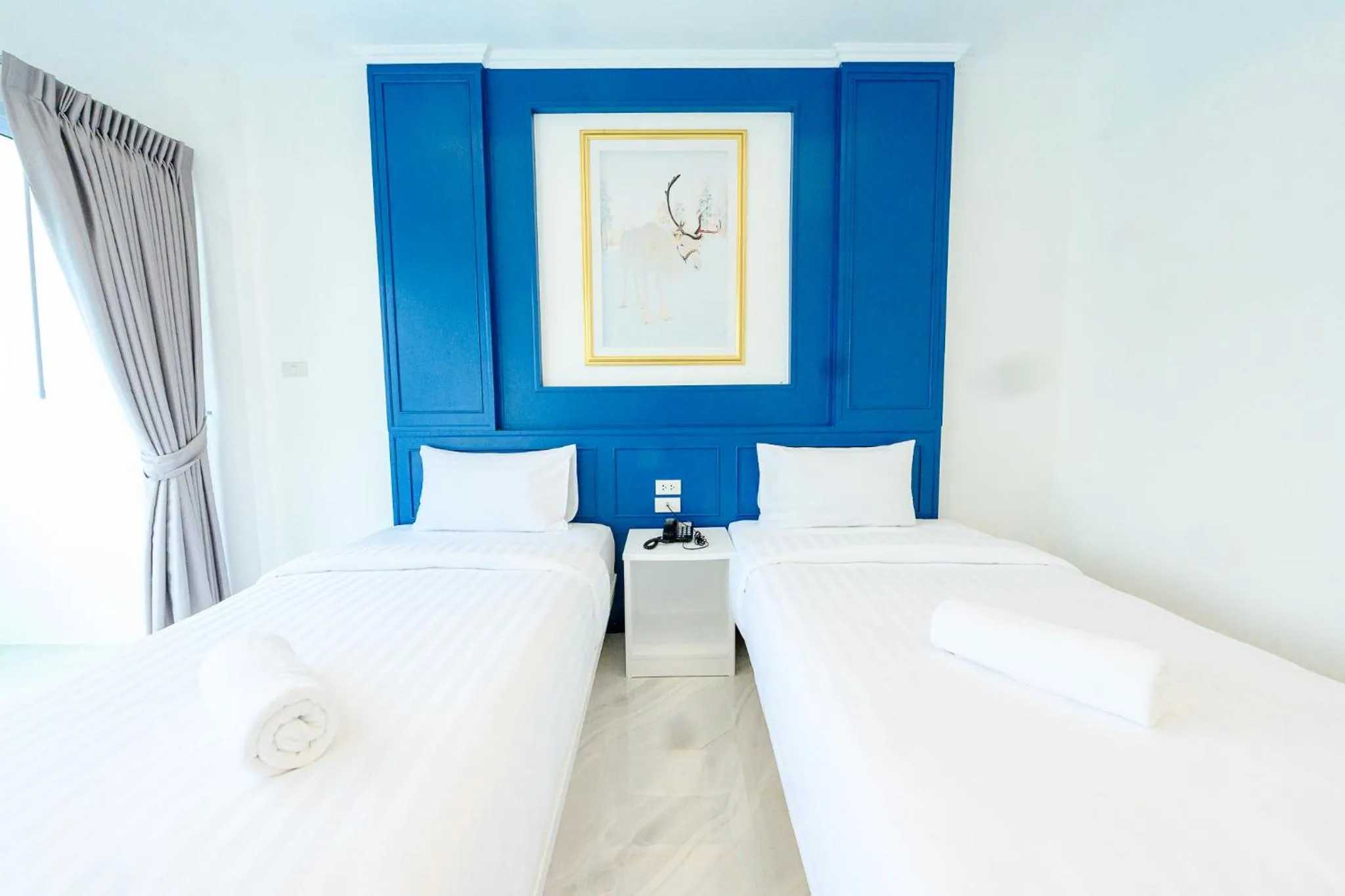 Bed in Marble Arch De Loei Hotel