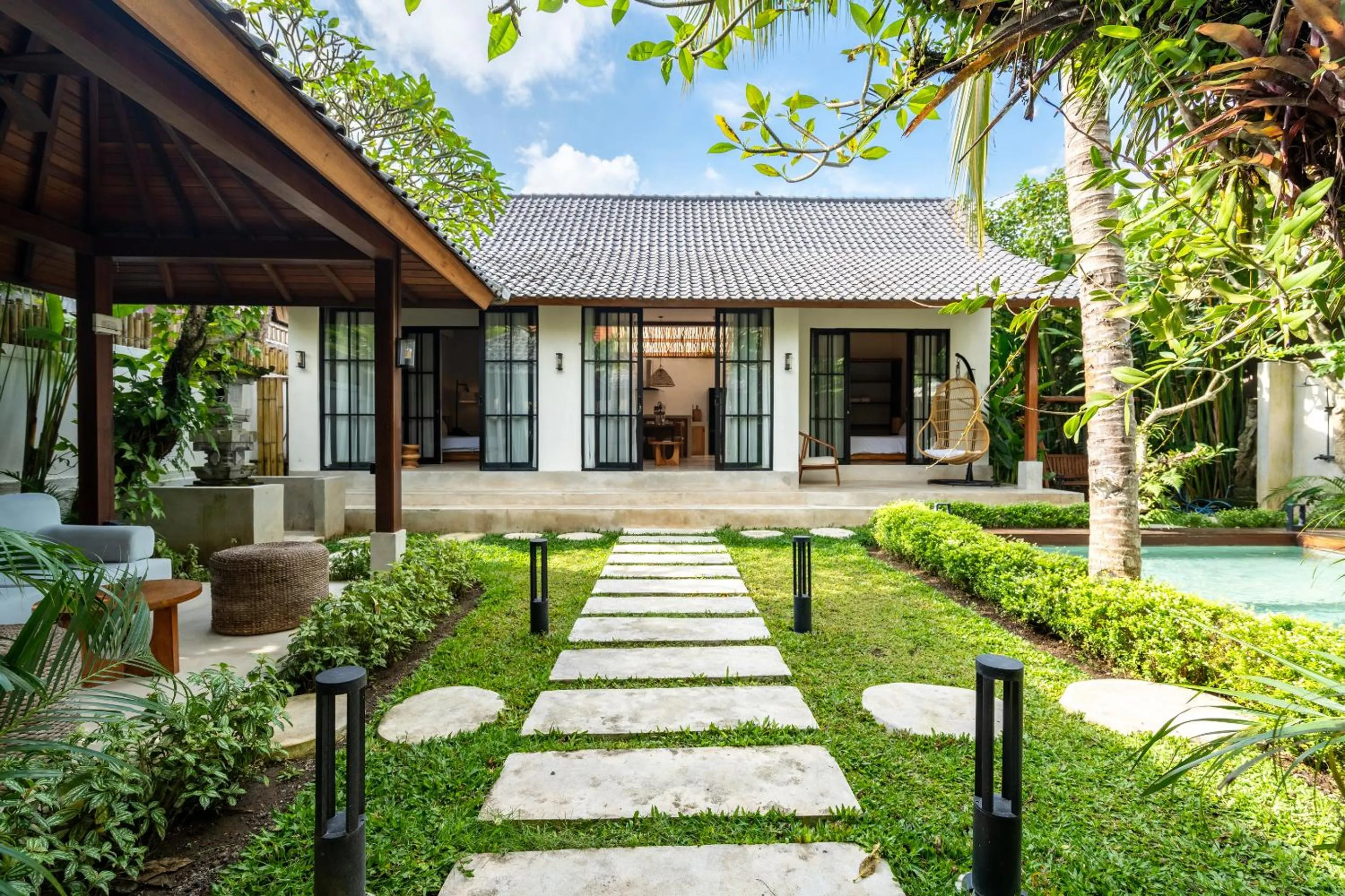 Property building in Hijau Villa by EVDEkimi - Charming 2BR escape with Pool, Outdoor Lounge, Lush Garden - New Year's Offer