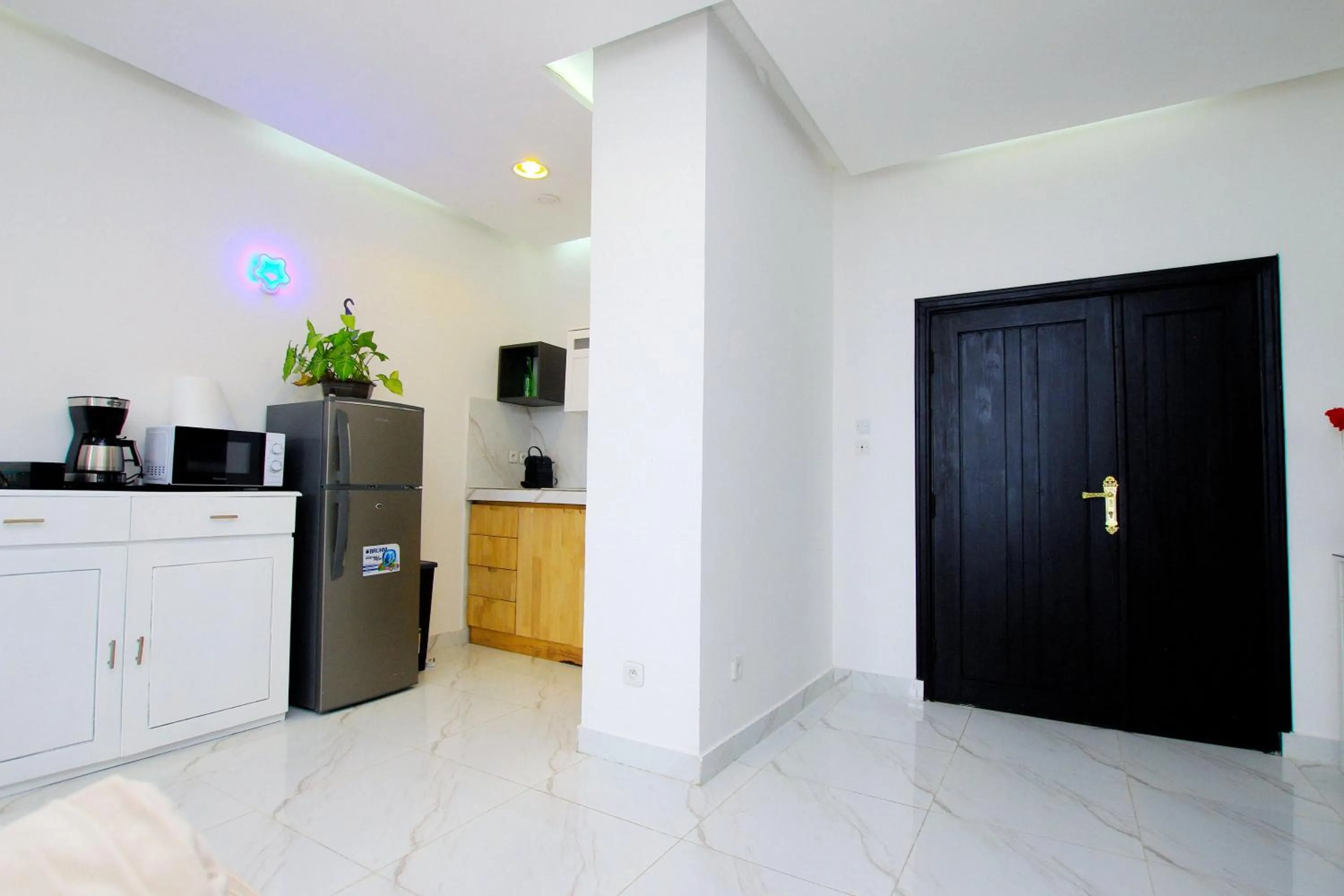 Kitchen or kitchenette in Appart Hotel Les orchidees