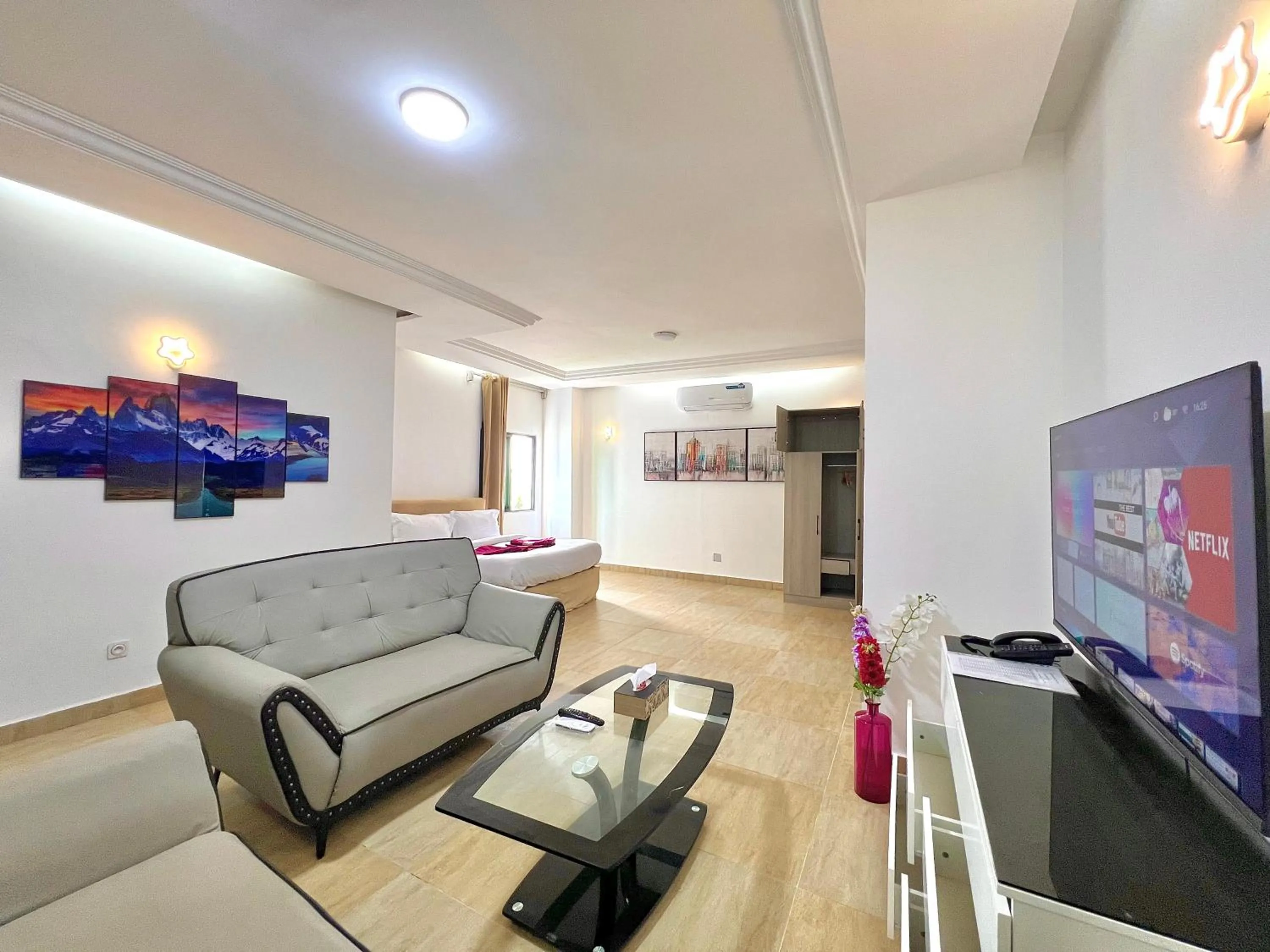 Communal lounge/ TV room in Appart Hotel Les orchidees