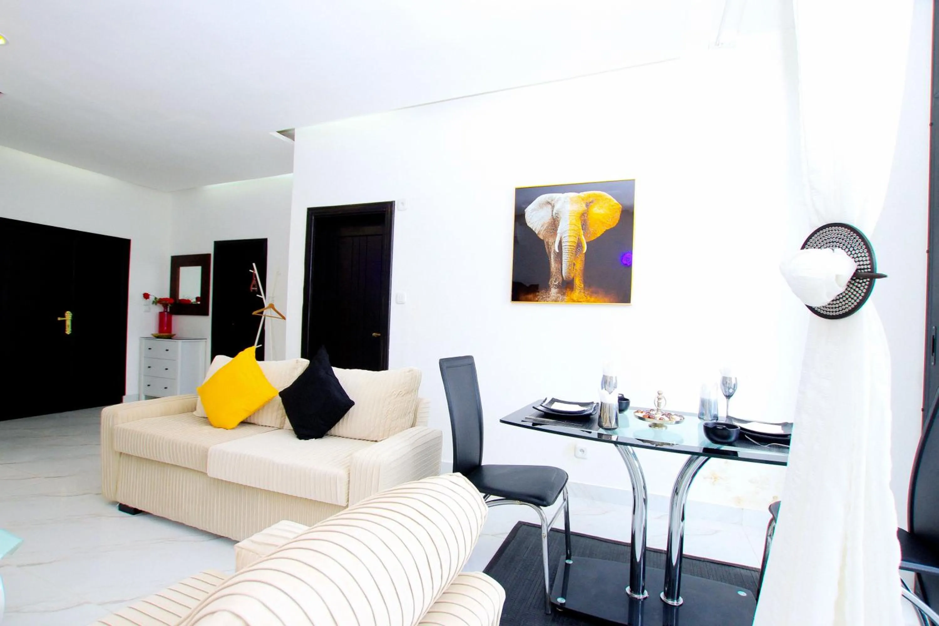 Living room in Appart Hotel Les orchidees