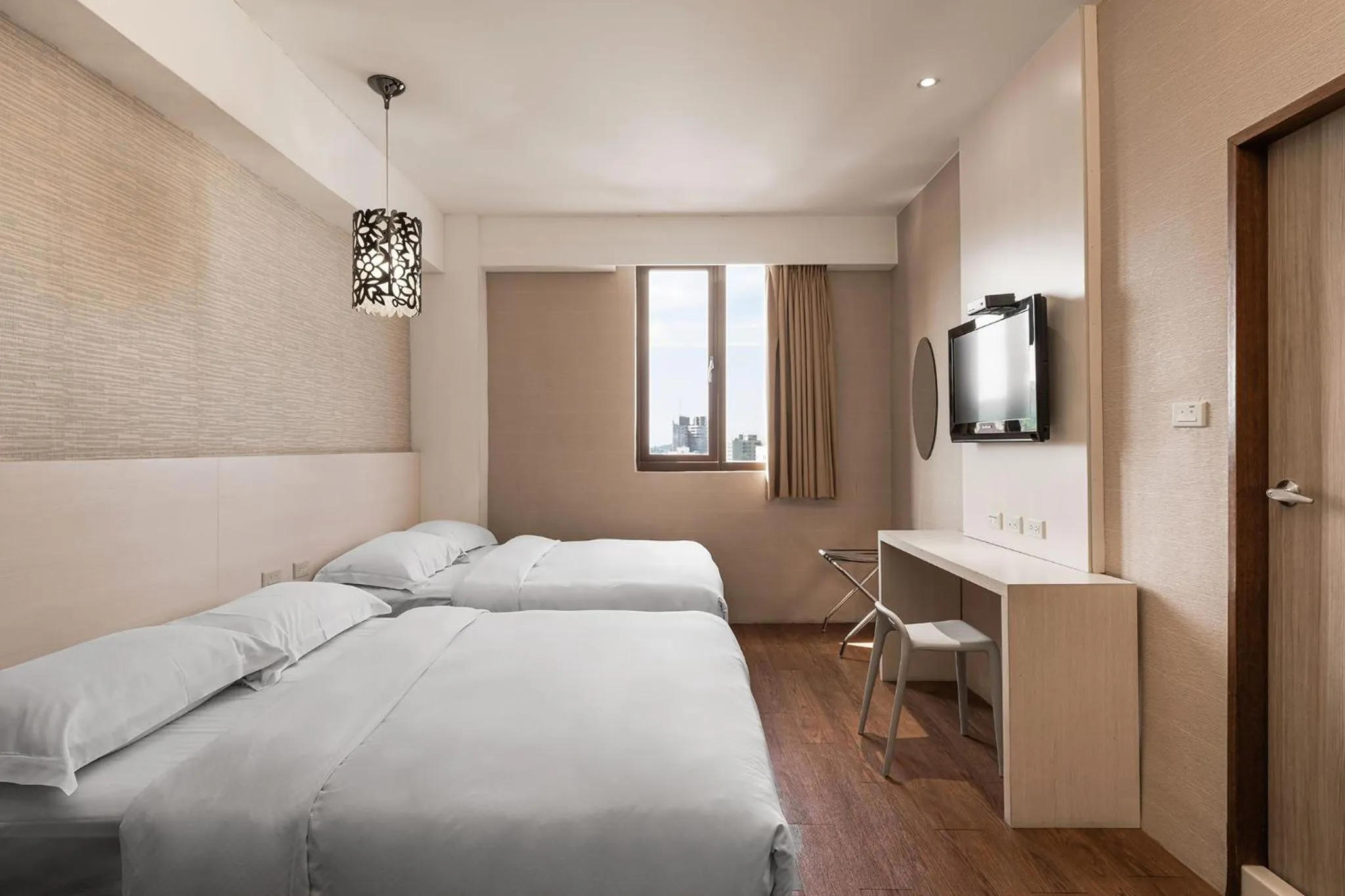 Photo of the whole room, Bed in The Riverside Hotel Hengchun