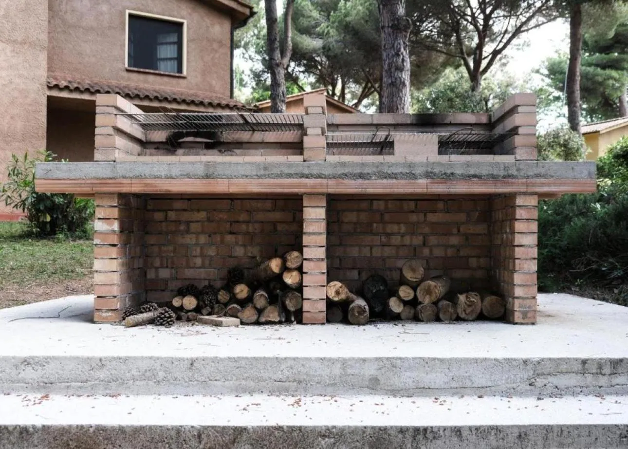 BBQ facilities in Residence with swimming-pool in Guardistallo surrounded by Nature