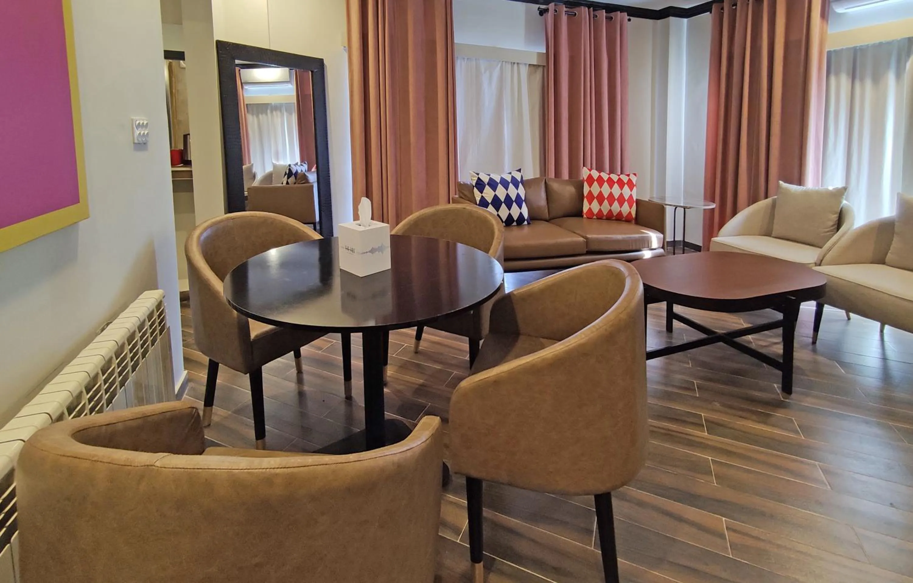 Living room in The Vibe By Ambiance