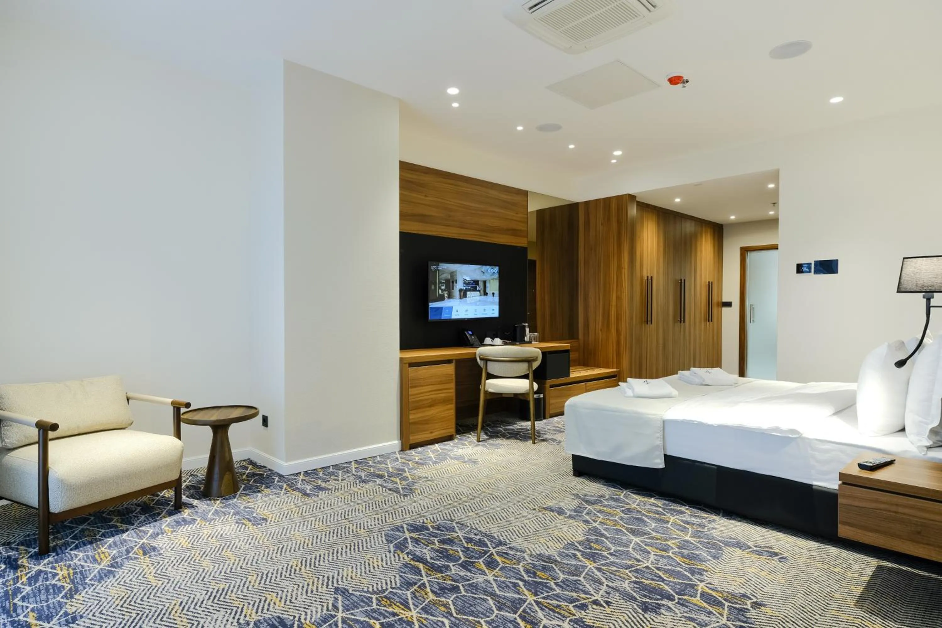 Seating area, Bed in Hotel Vema