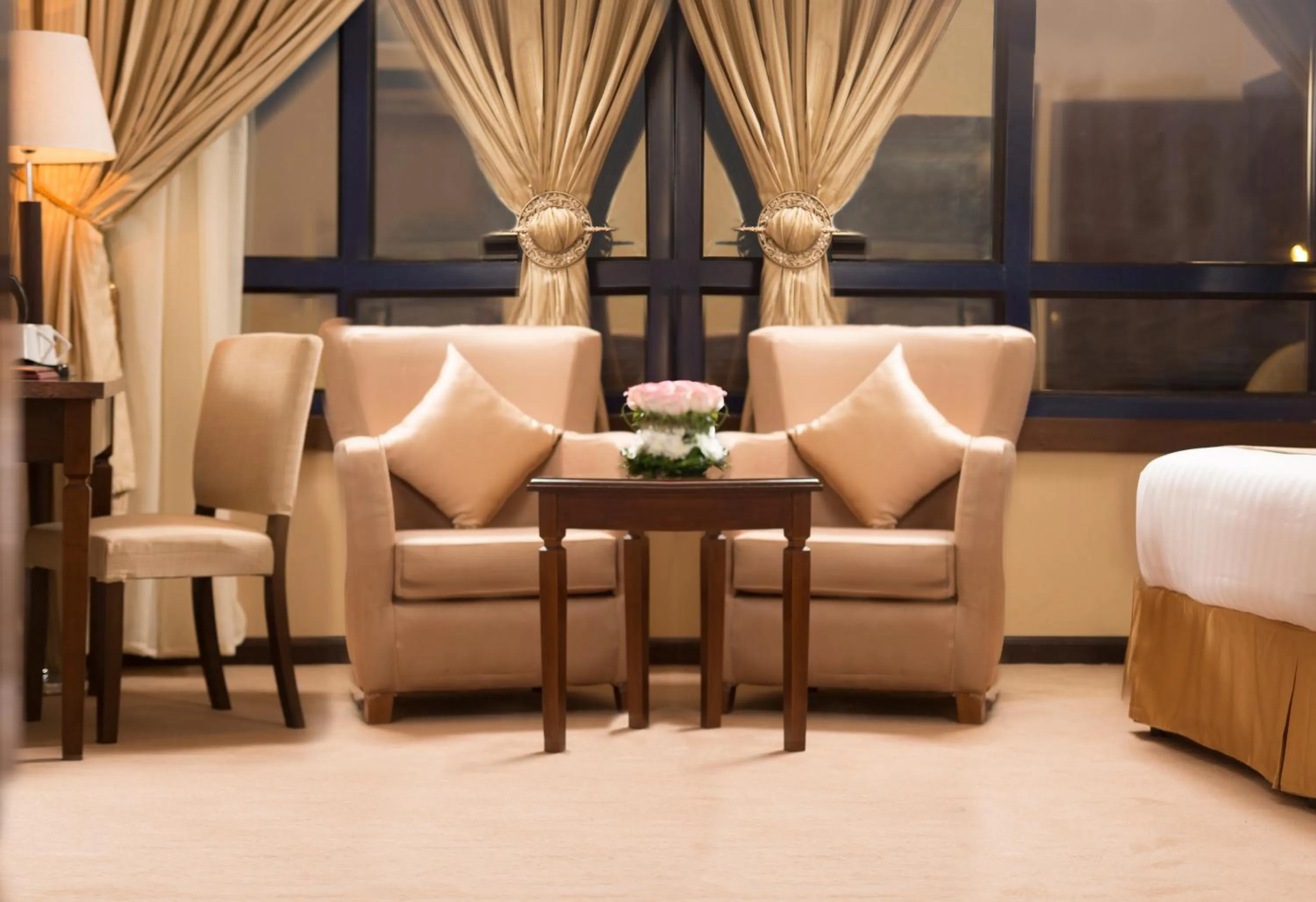 Seating area, Bed in Razana Al Rawdha Hotel