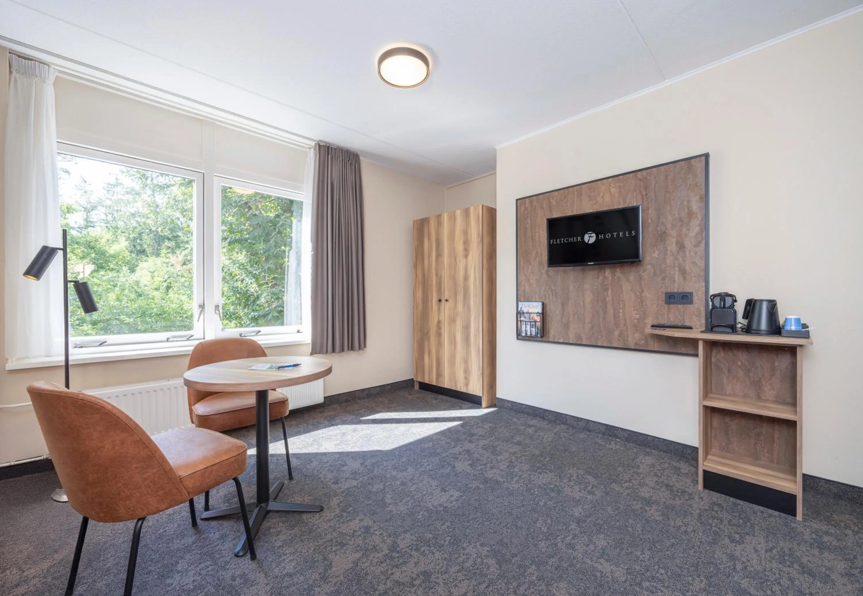 Bedroom in Fletcher Hotel Restaurant De Eese