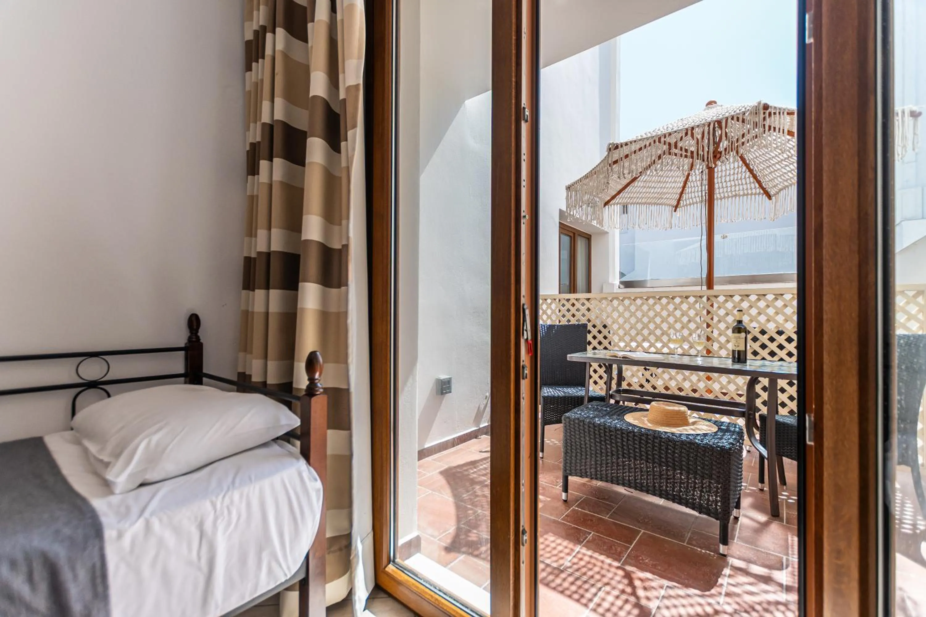 Inner courtyard view, Bed in Kallisti Studios