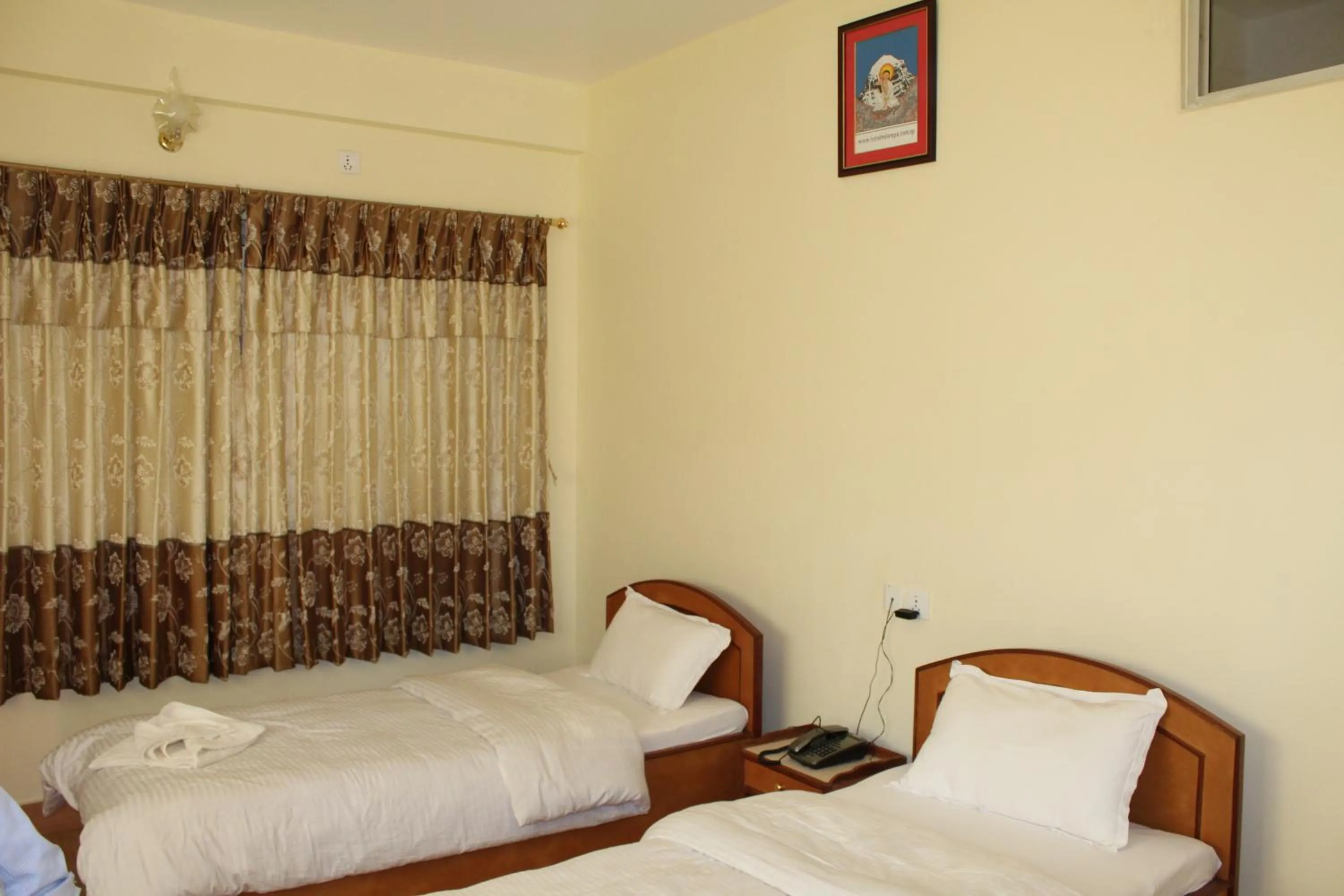 Bedroom in Hotel Milarepa Pvt Ltd