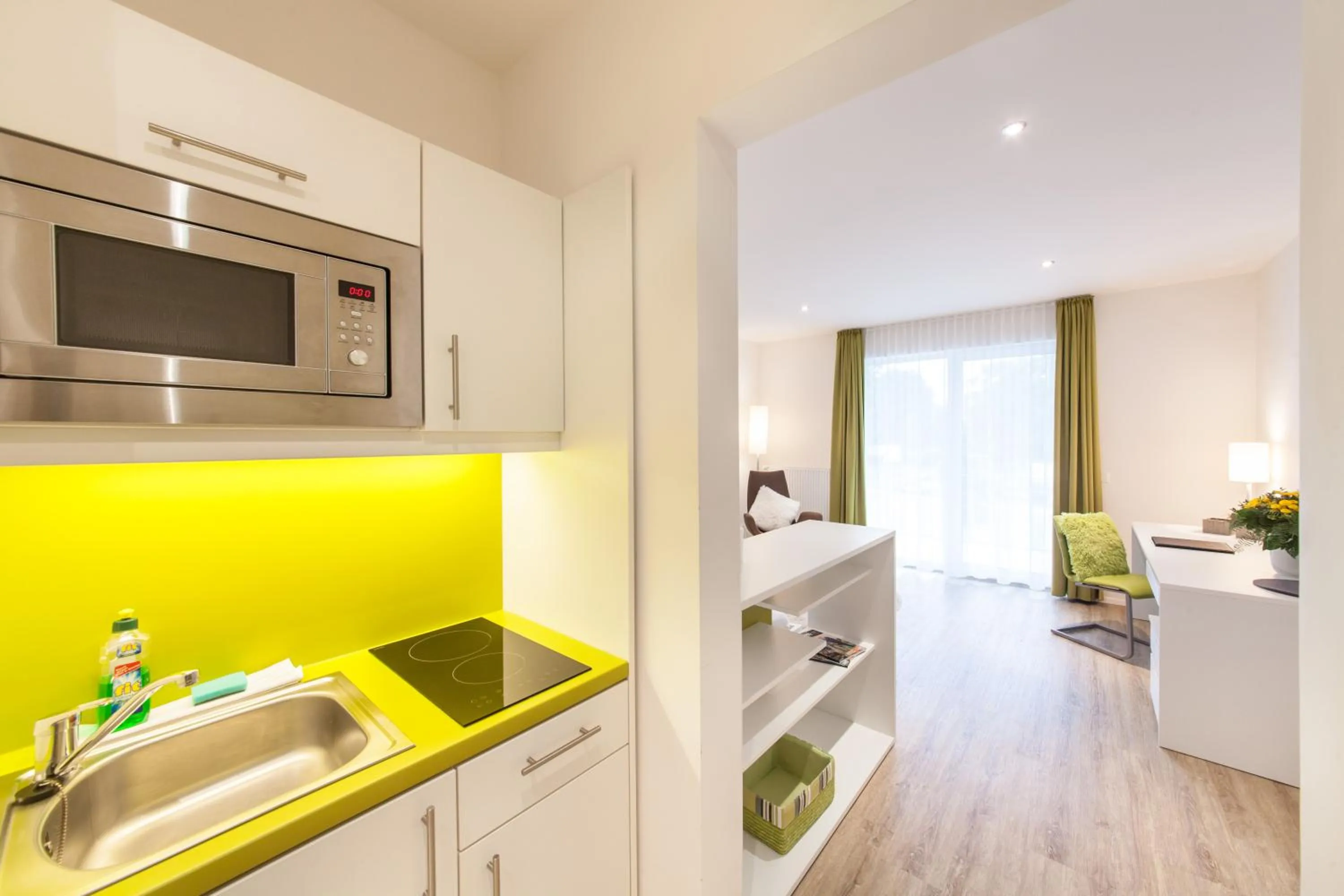 Kitchen or kitchenette in acora Fürth Living the City