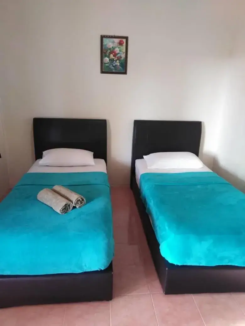 Bed in Tokman Inn Bed in Tokman Inn