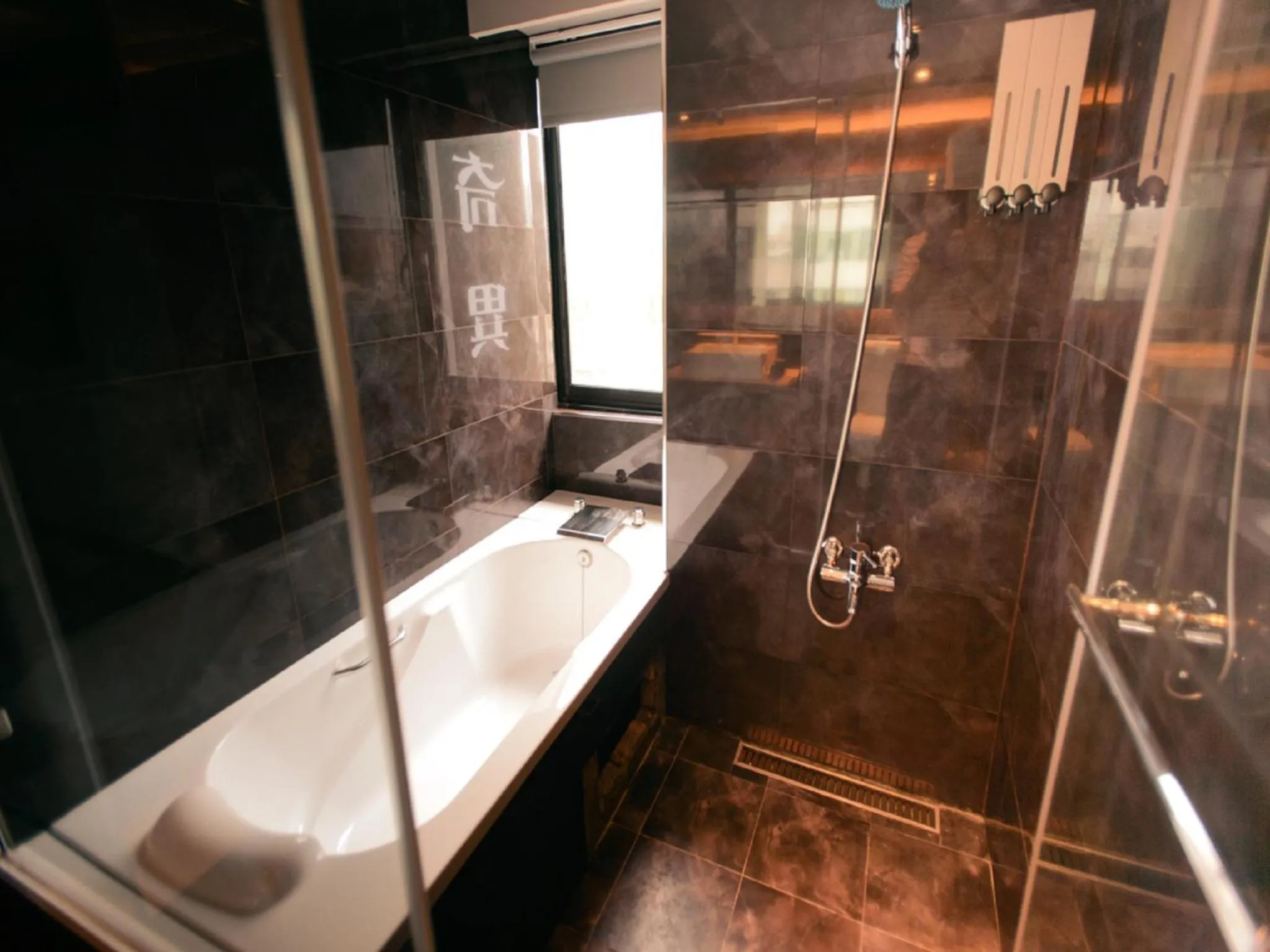 Bathroom in Kiwi Express Hotel - Jiuru Rd