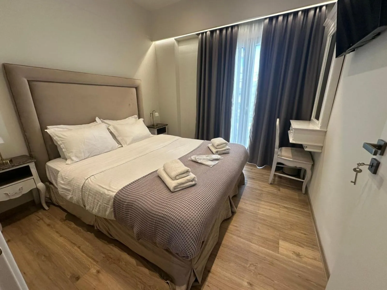 Bed in Acropolis Divine Apartments