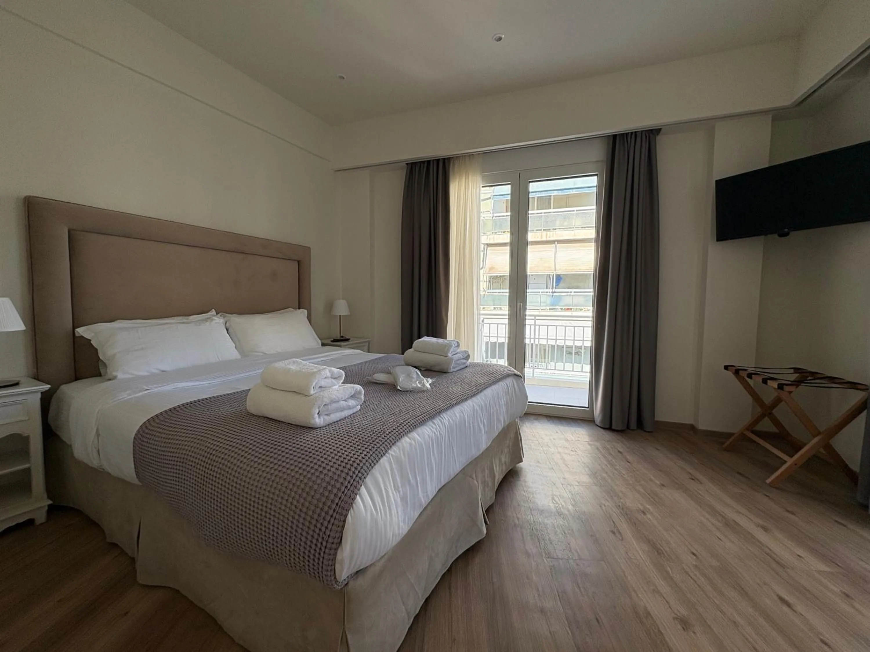 Bed in Acropolis Divine Apartments