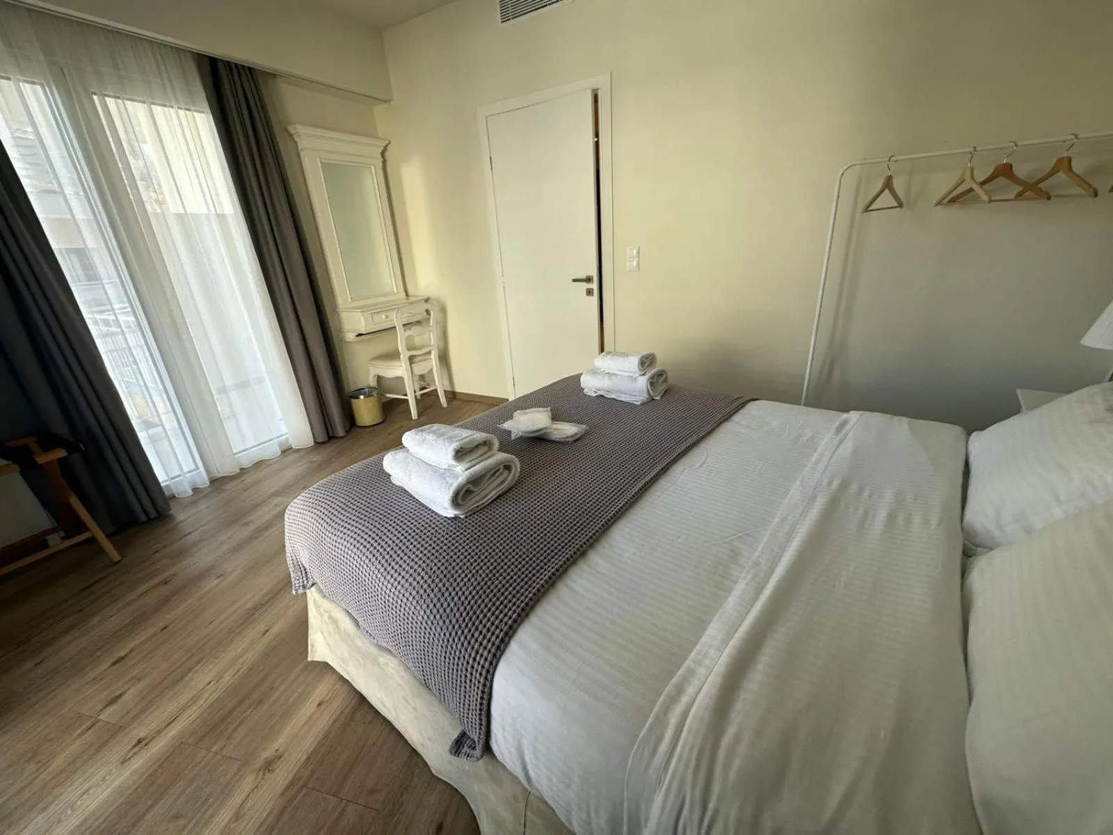 Bed in Acropolis Divine Apartments