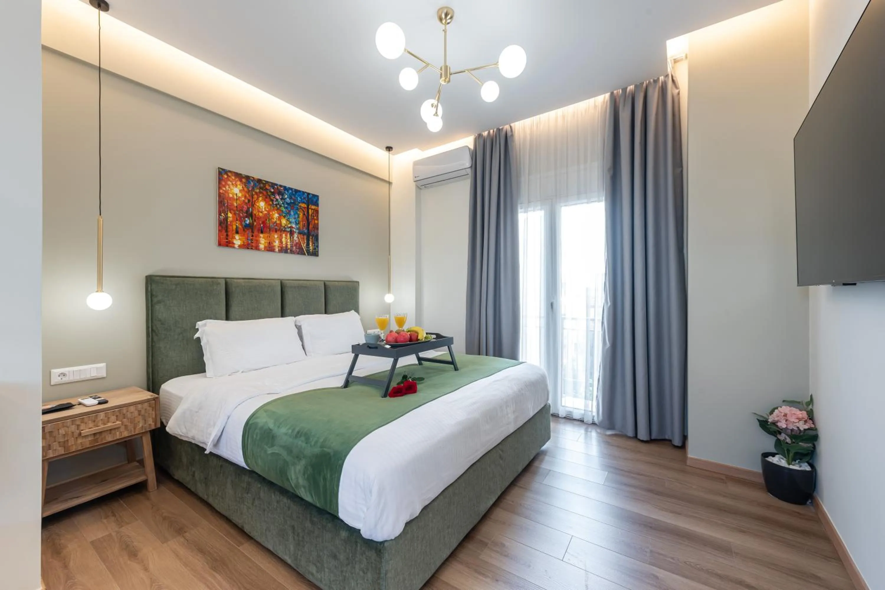 Bed in Acropolis Divine Apartments