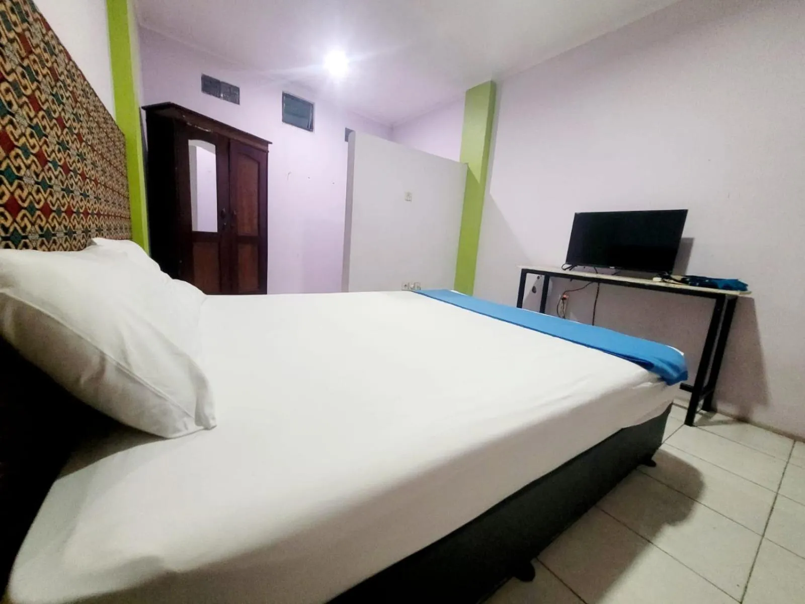 Bed in Wisma Gahalta by Fans