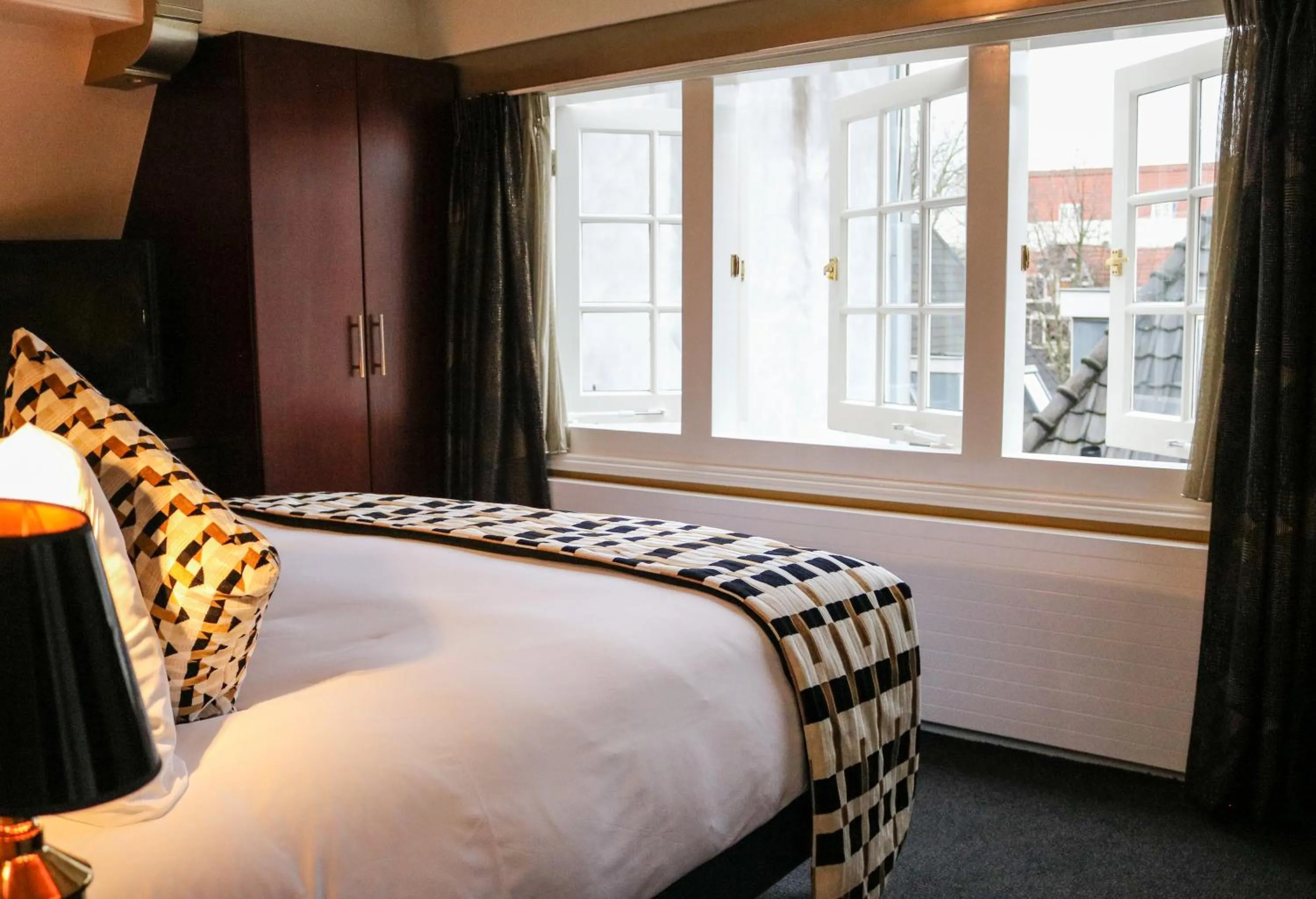 Bed in Ambassade Hotel