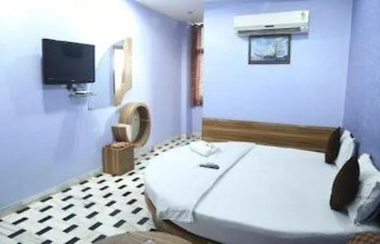 Bed in HOTEL HAYAT RESIDENCY