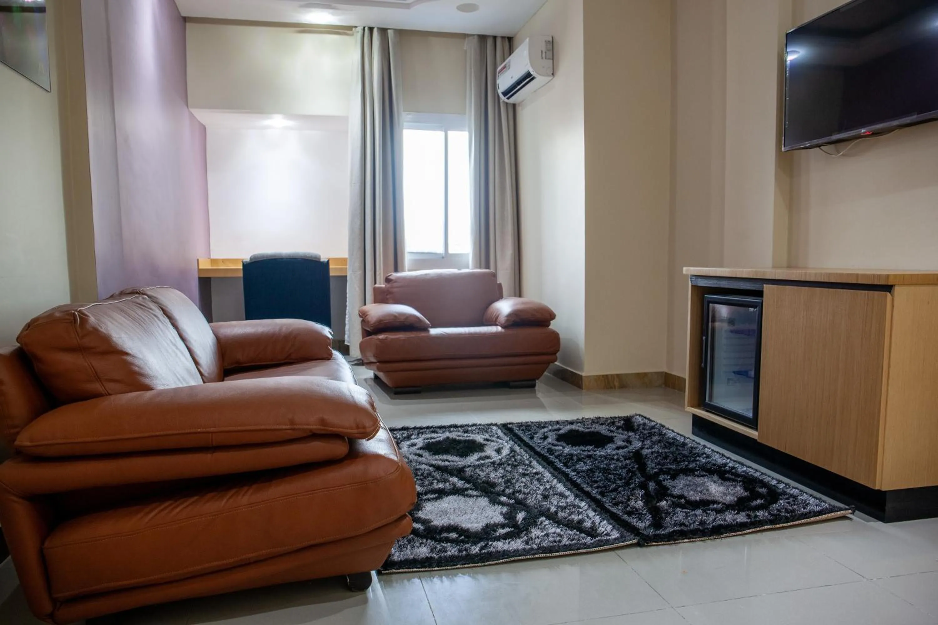 Communal lounge/ TV room in HOTEL MICKEL