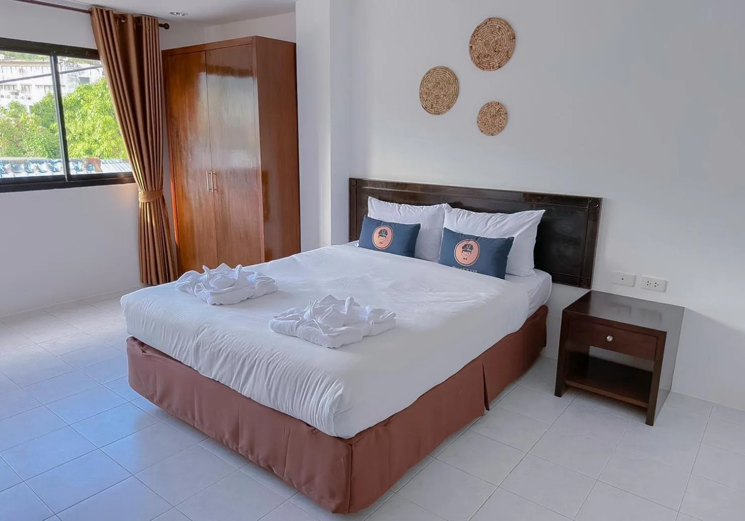 Bed in RoomQuest Kalim Beach