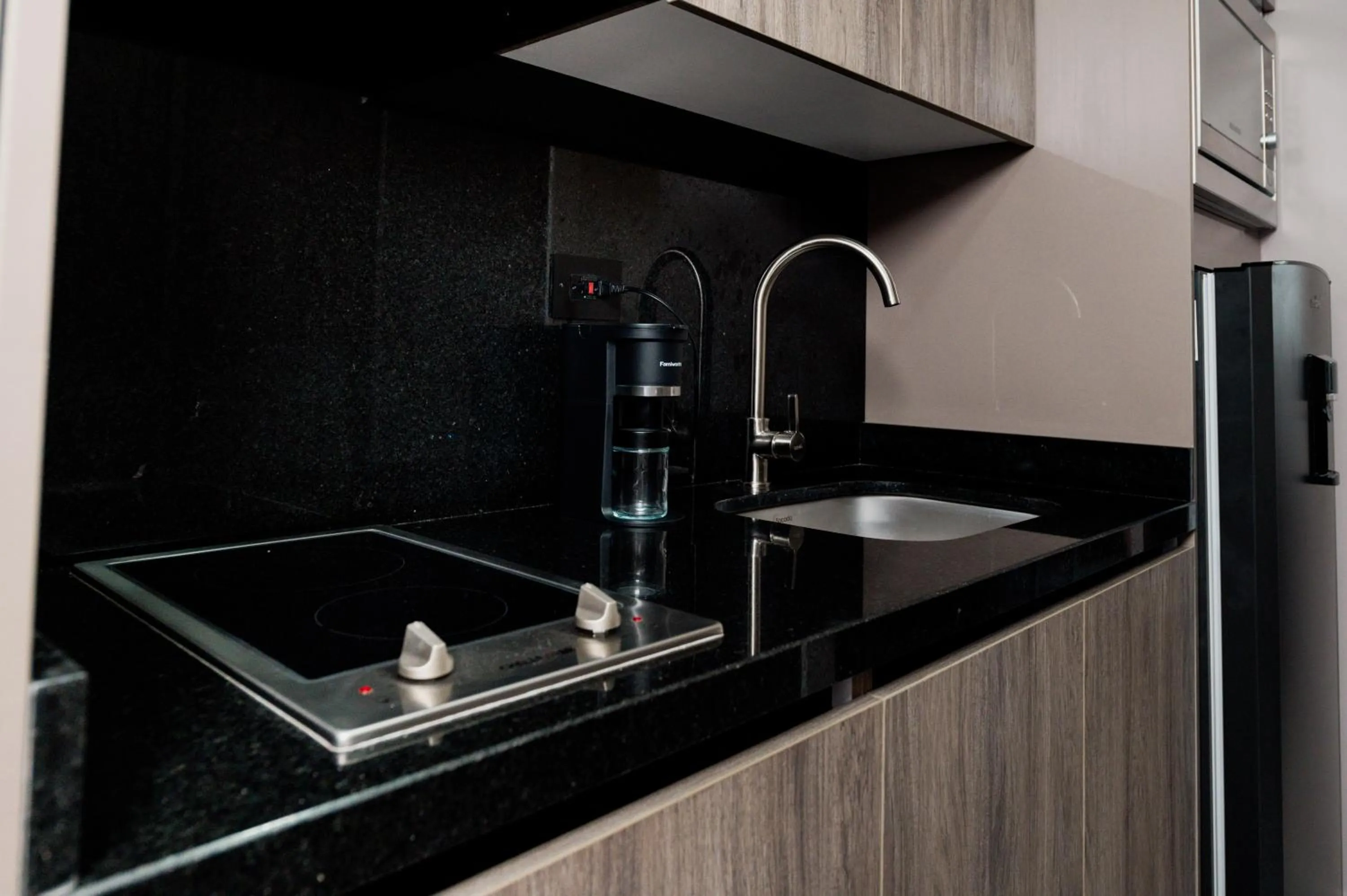 Kitchen or kitchenette in Amari Living Suites