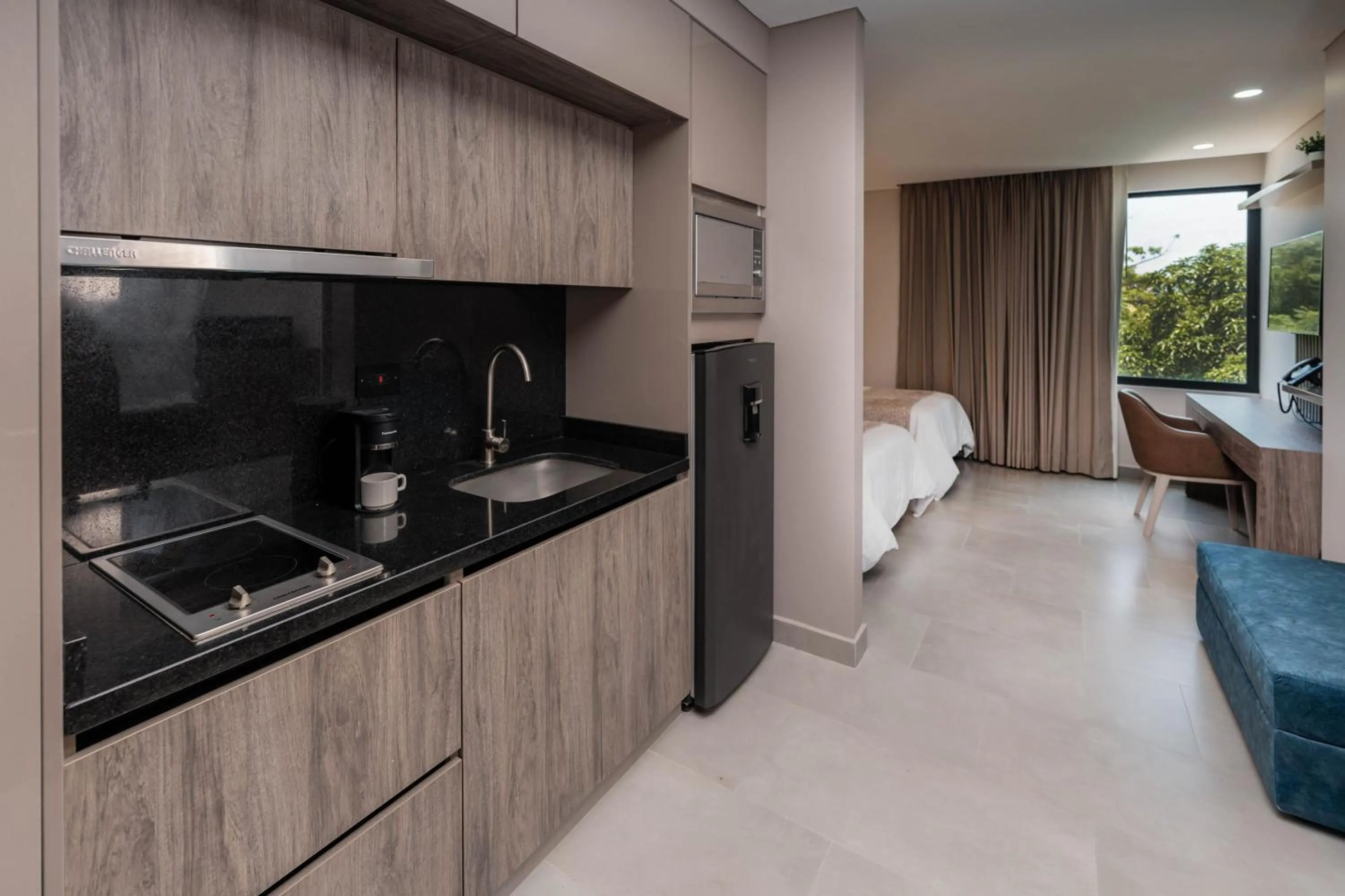 Kitchen or kitchenette in Amari Living Suites