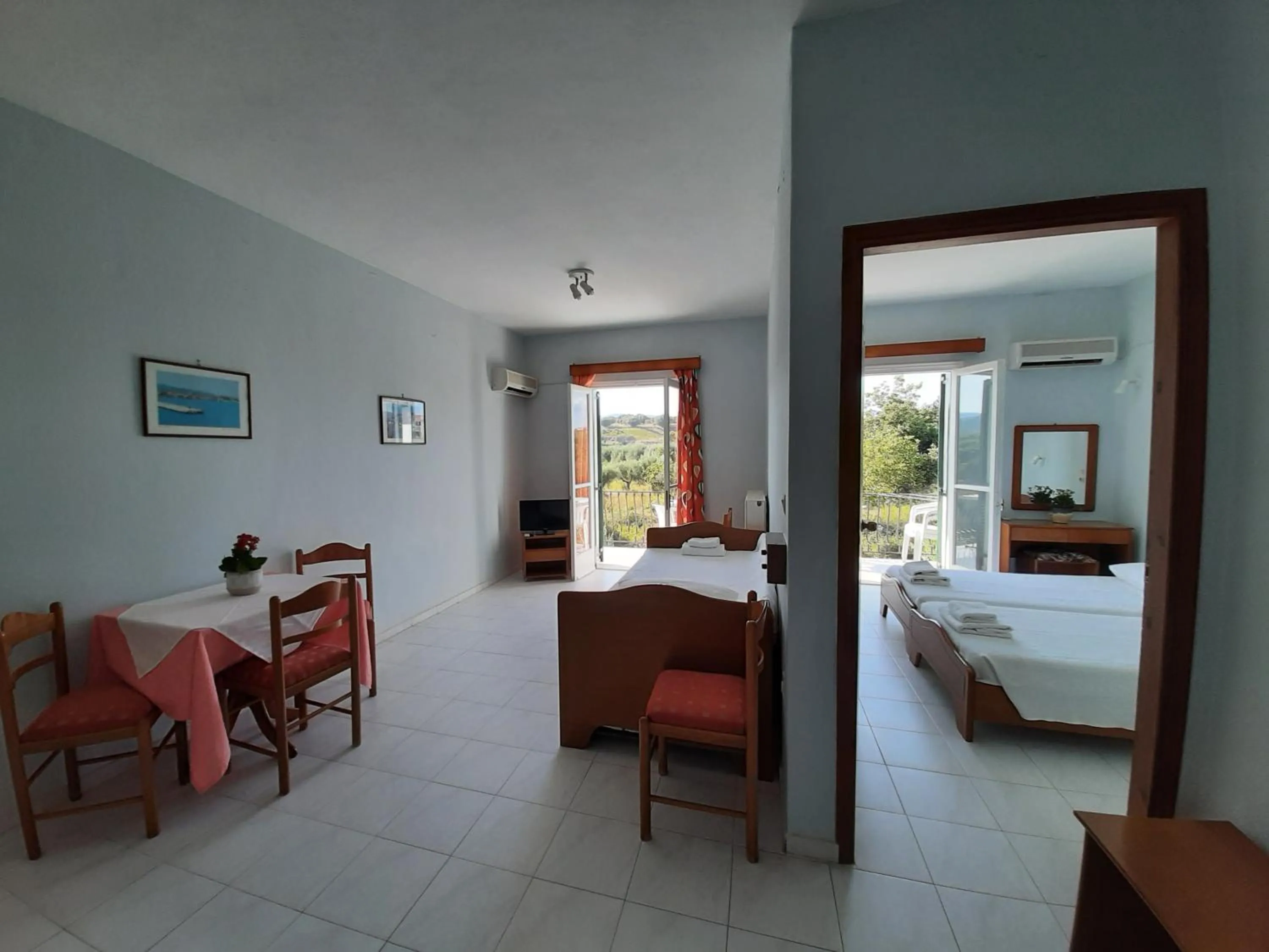 Seating area, Bed in Ammousa Hotel Apartments