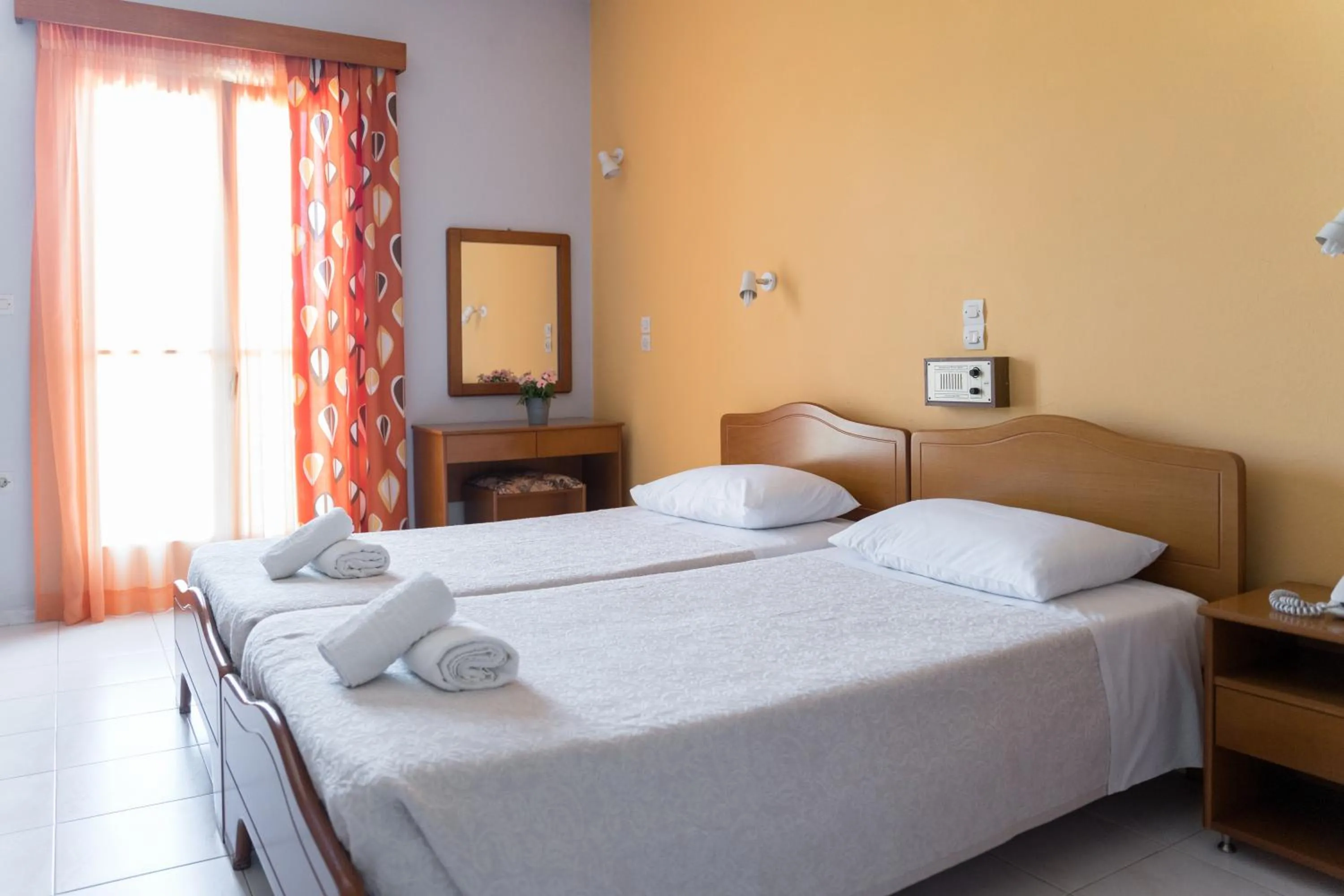 Bed in Ammousa Hotel Apartments