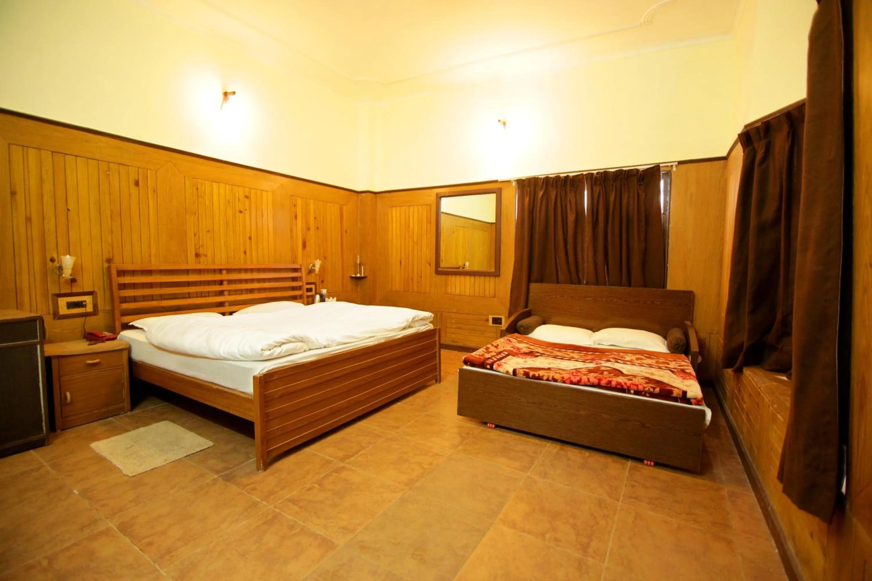 Bedroom in Ashoka Naini Chalet