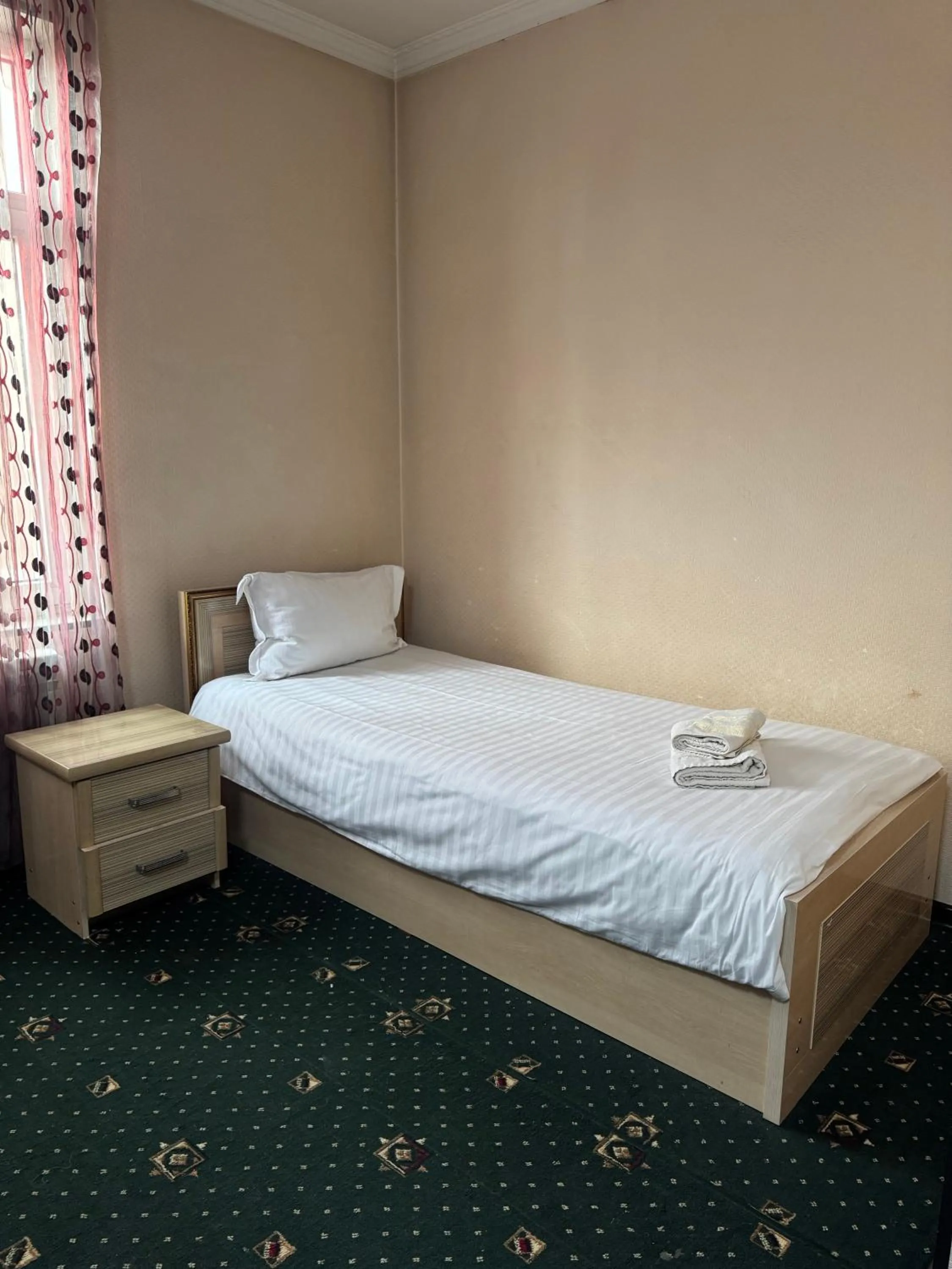 Bed in Boston Hotel Tashkent