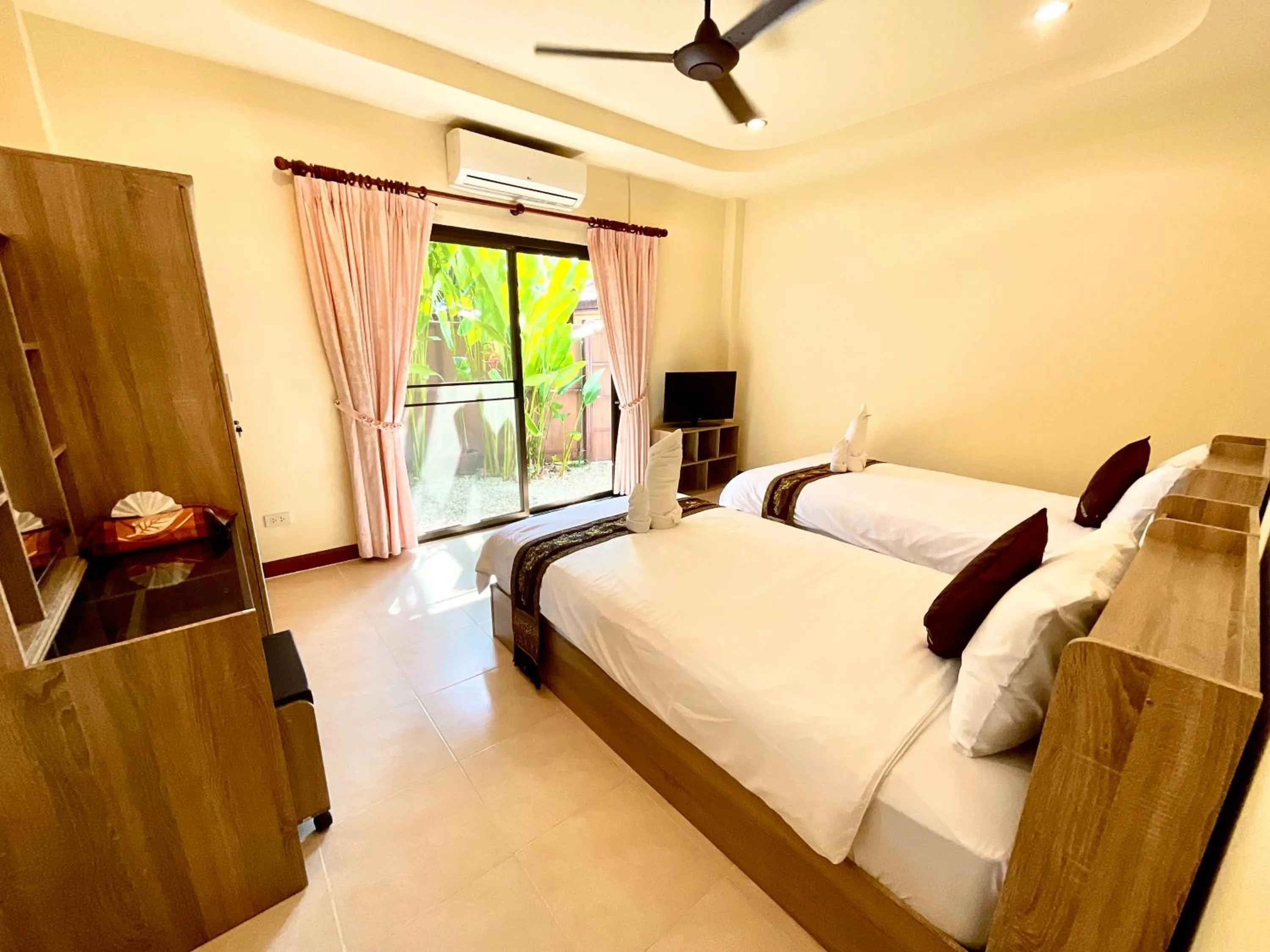 Bedroom in Coconut Paradise Holiday Villas
