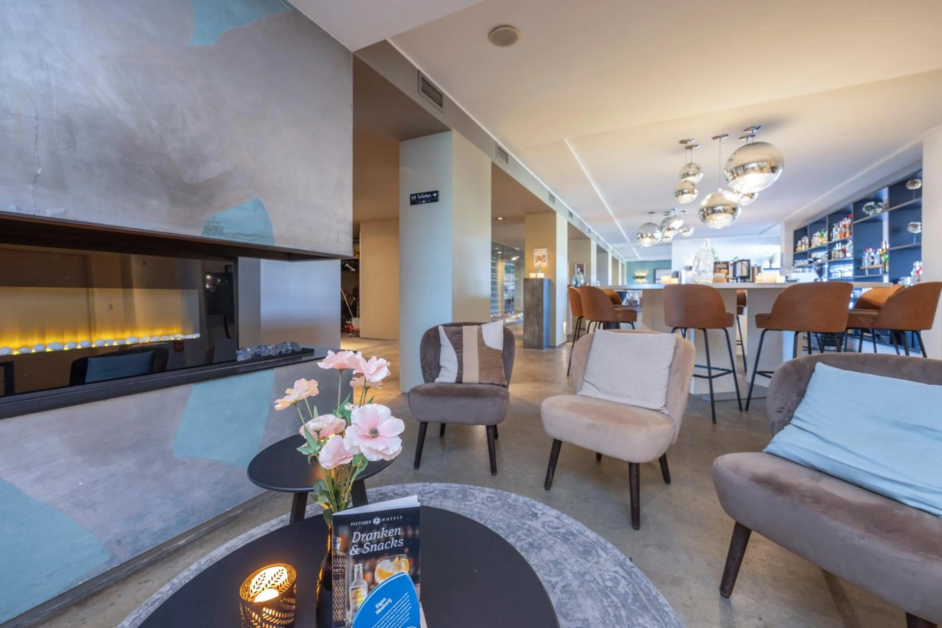 Seating area in Fletcher Hotel - Restaurant Elzenduin