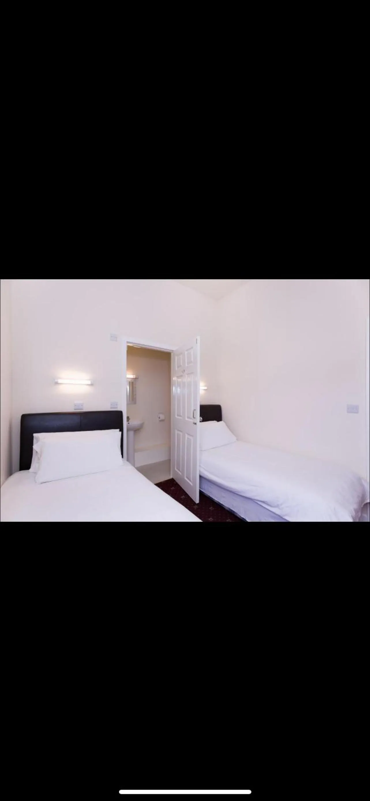 Bed in North Ocean Hotel