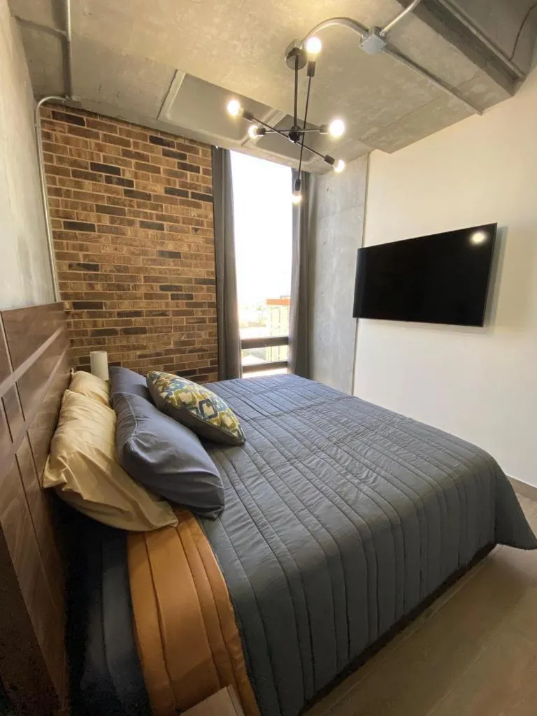 Bed in Lux 2 bedroom apartment, swimming pool, gym and free parking spot in Macro Plaza area