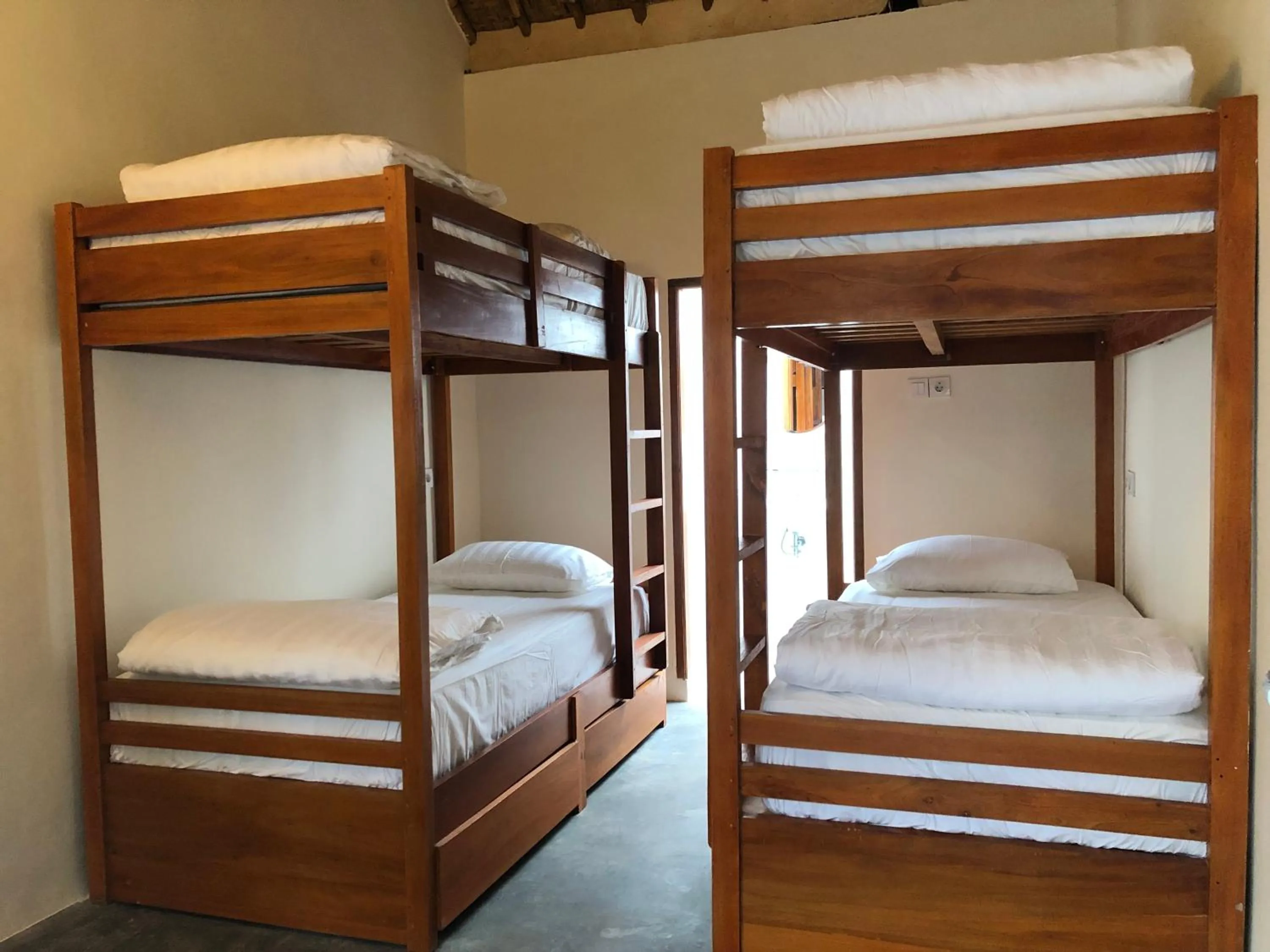 Bed in Roots Hotel Trawangan