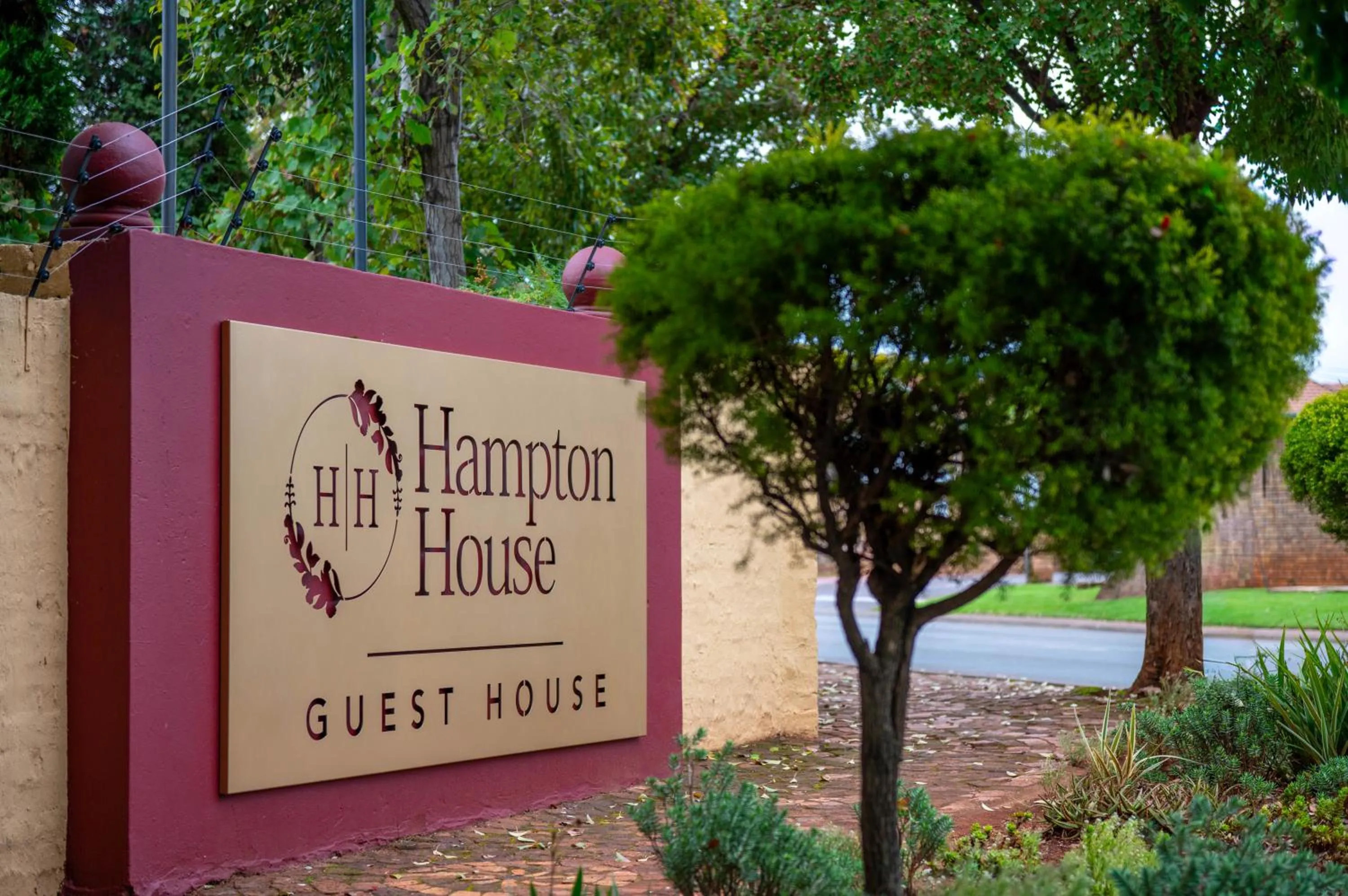 Property logo or sign in Hampton House Guest House