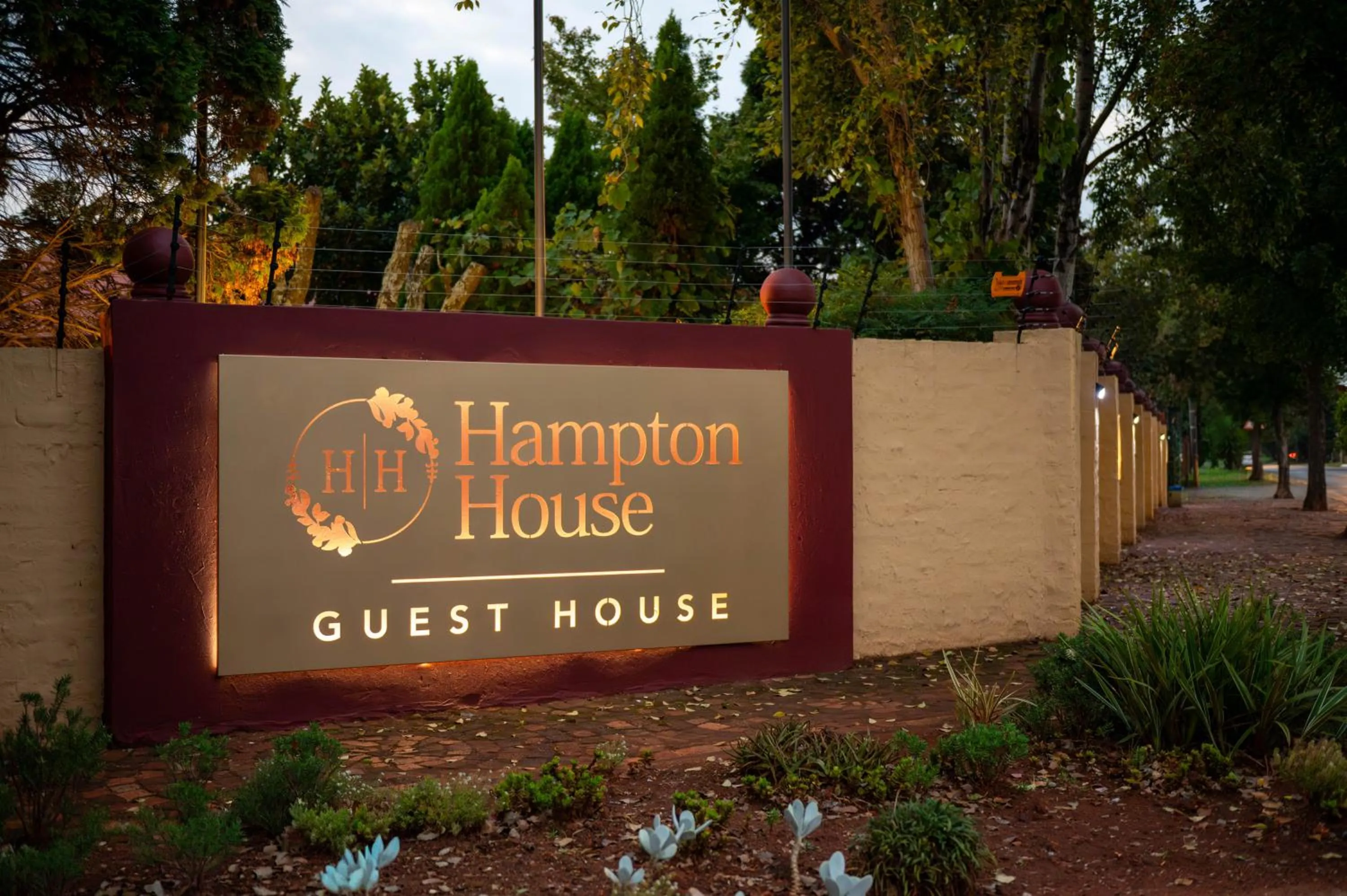 Property logo or sign in Hampton House Guest House