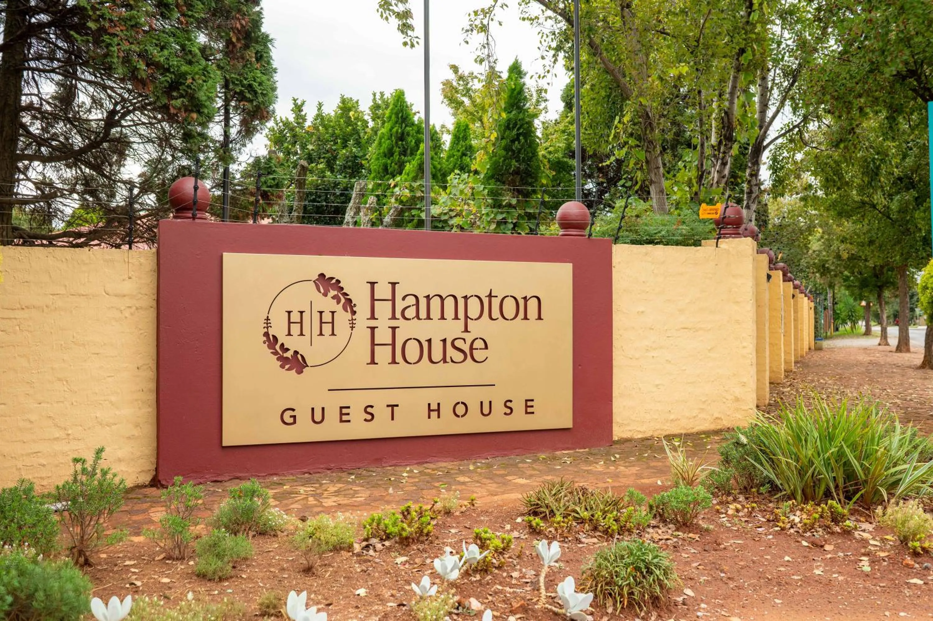 Property logo or sign in Hampton House Guest House