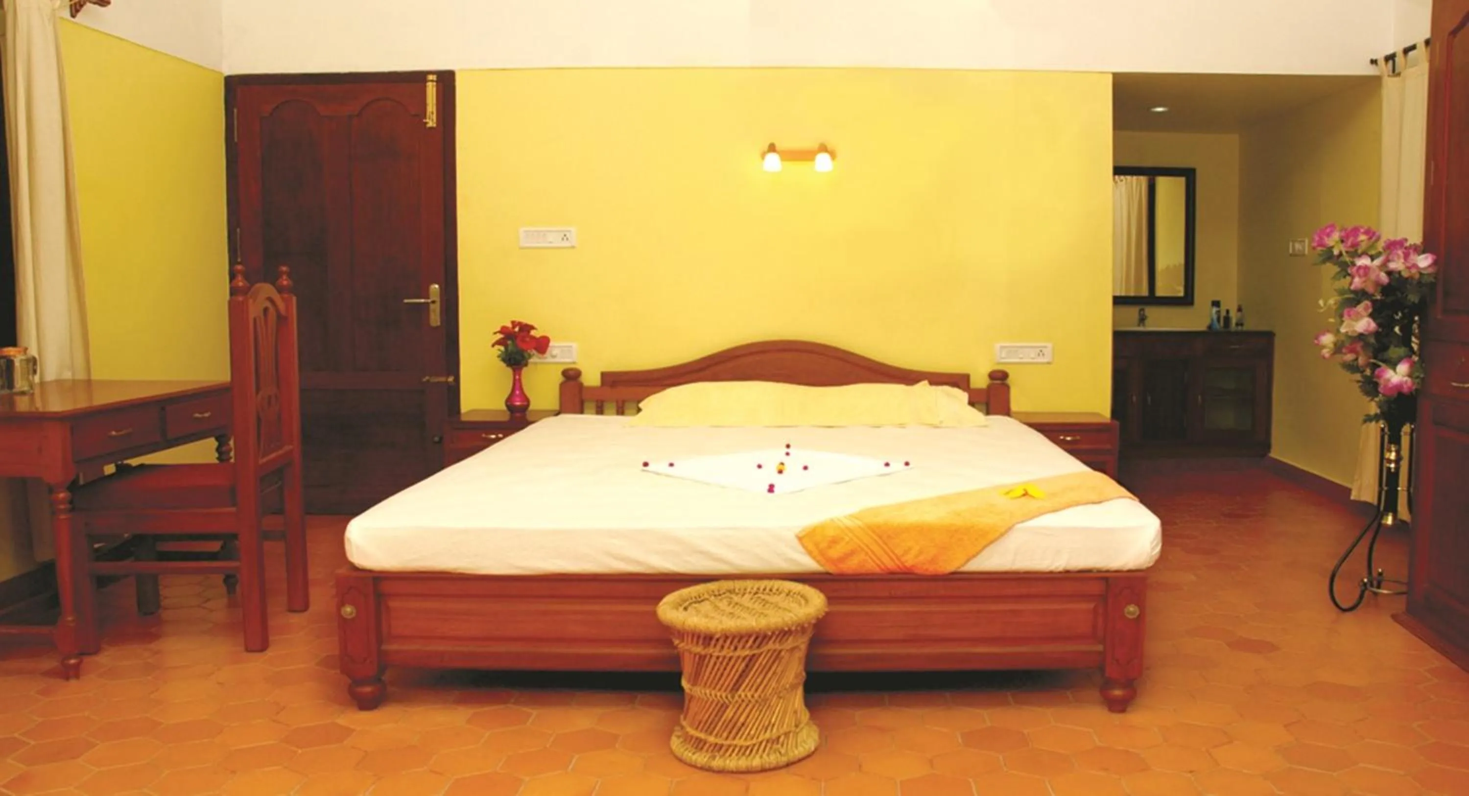 Bed in Amrutham Ayurvedic Village Resort