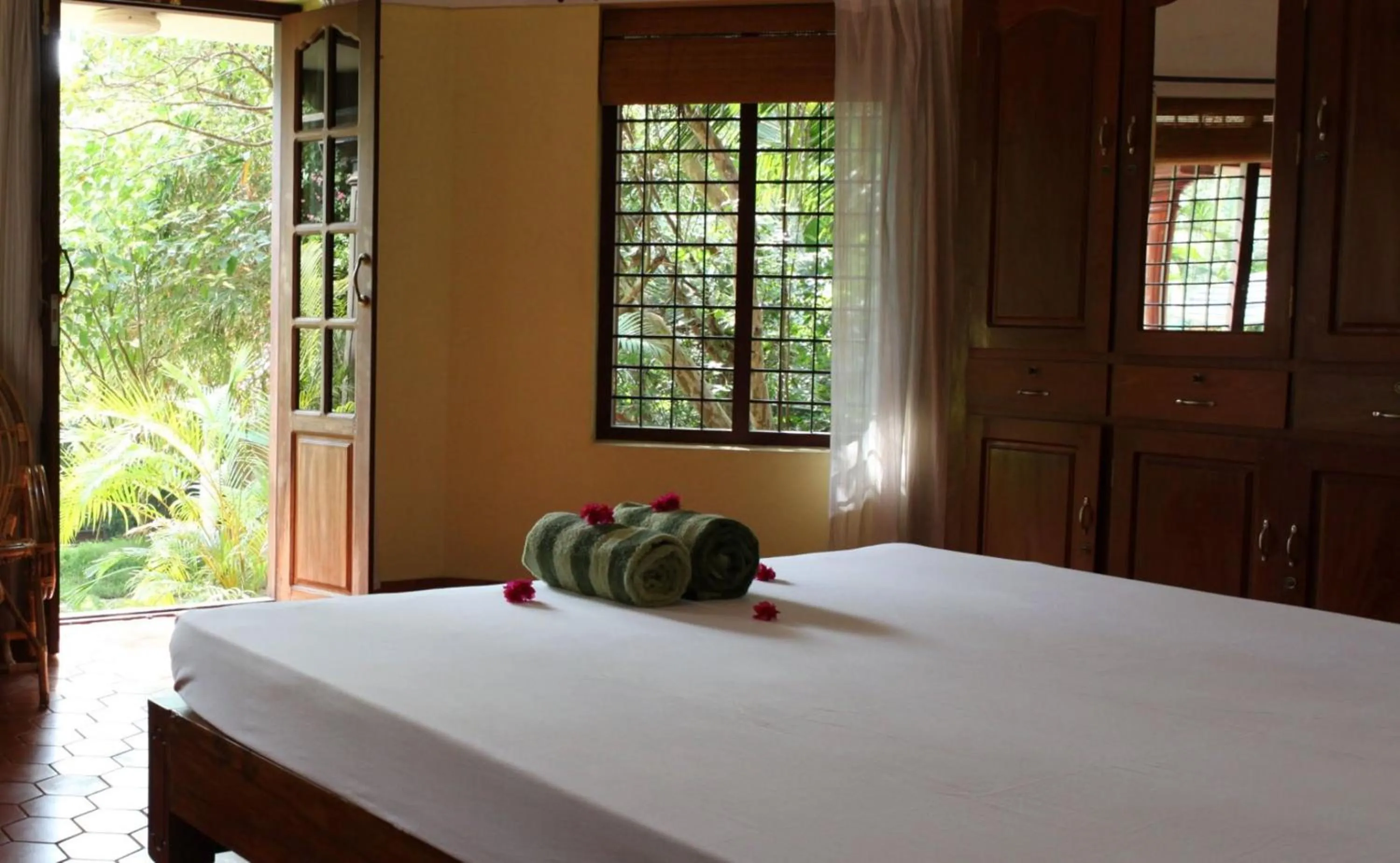 Photo of the whole room, Bed in Amrutham Ayurvedic Village Resort