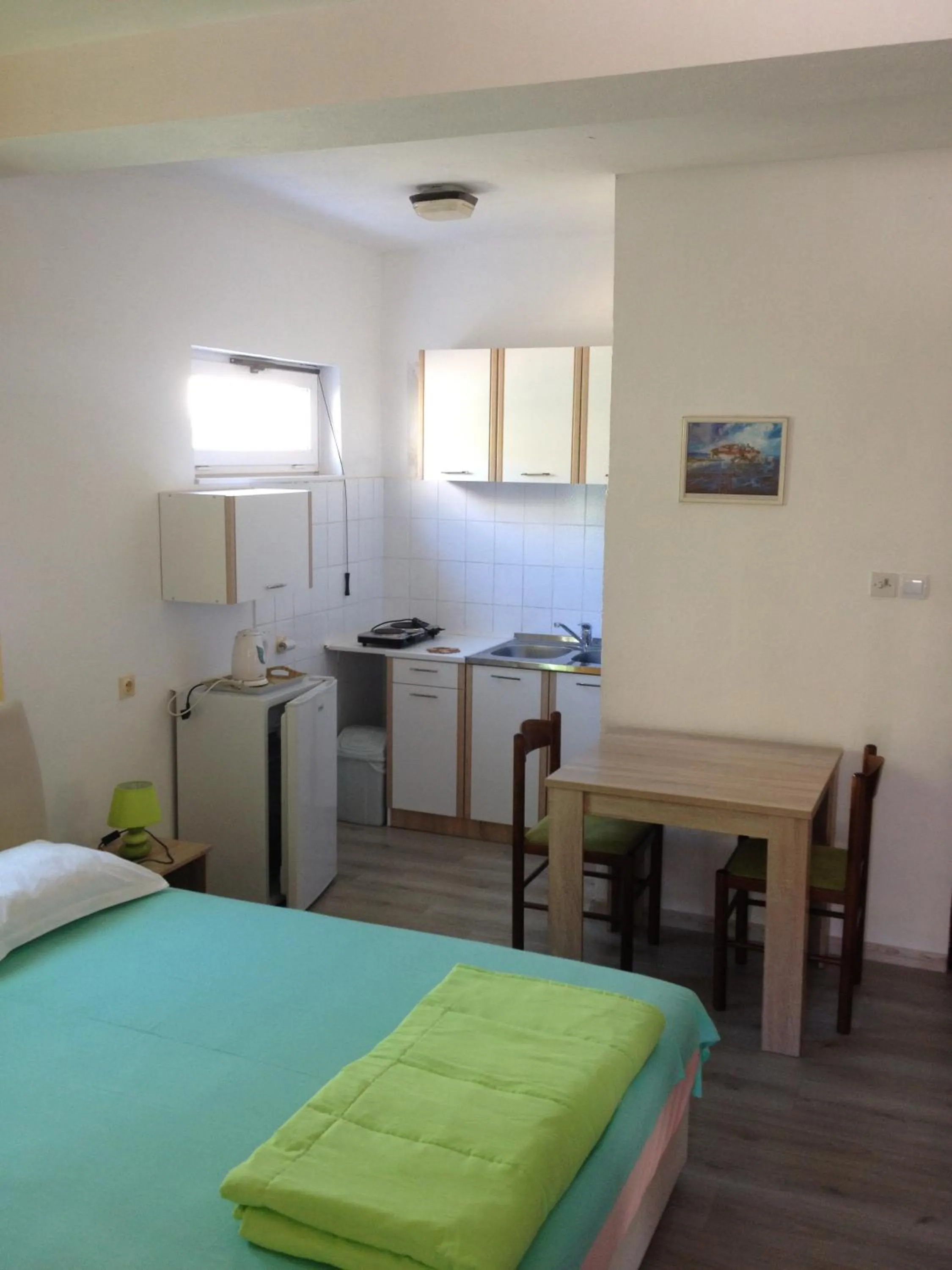 Kitchen or kitchenette, Bed in Apartments Kordic