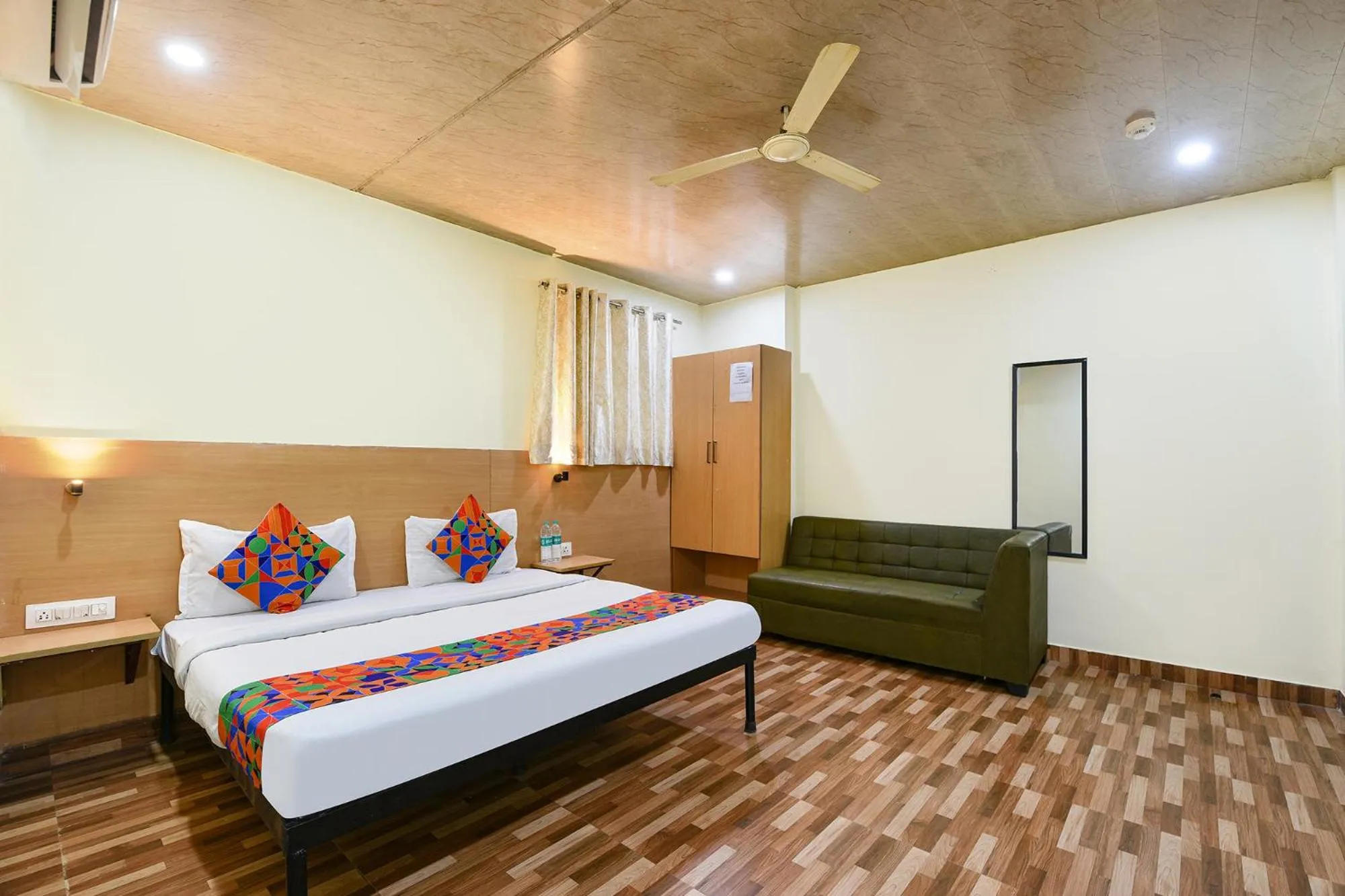 Bed in FabHotel Royal Reena Residency