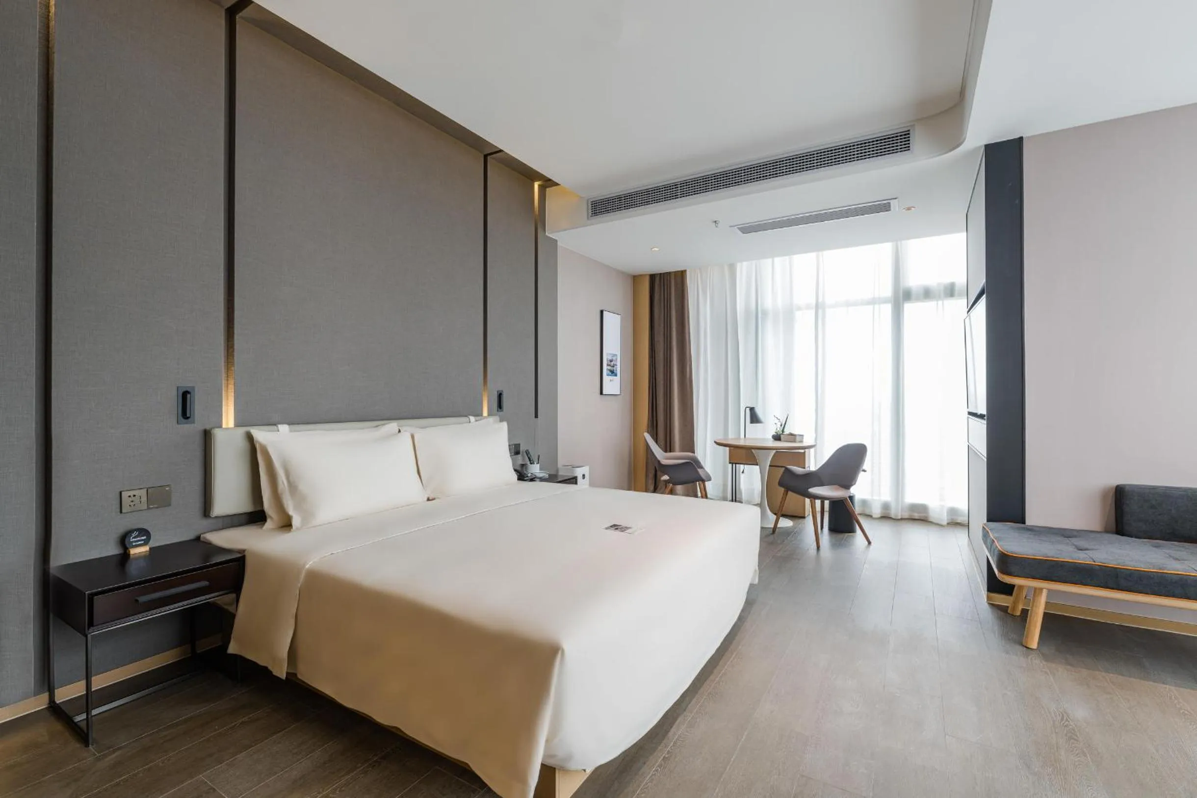 Bed in Atour Hotel Wuxi Coast City